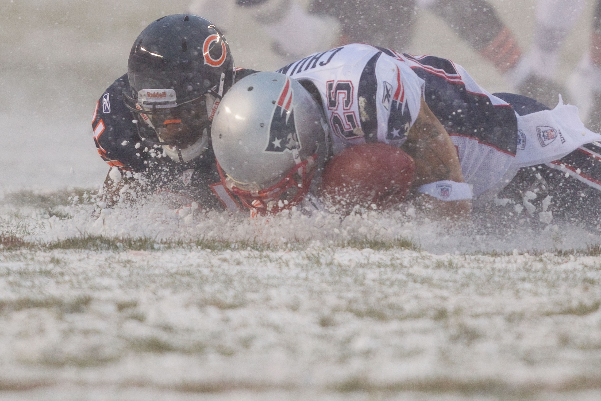 CHICAGO, IL - DECEMBER 12: Pat Chung #25 of the New England Patriots looks to recover a fumble Corey Graham #21 of the Chicago Bears at Soldier Field on December 12, 2010 in Chicago, Illinois. The Patriots beat the Bears 36-7. (Photo by Dilip Vishwanat/ CHICAGO, IL - DECEMBER 12: Pat Chung #25 of the New England Patriots looks to recover a fumble Corey Graham #21 of the Chicago Bears at Soldier Field on December 12, 2010 in Chicago, Illinois. The Patriots beat the Bears 36-7. (Photo by Dilip Vishwanat/