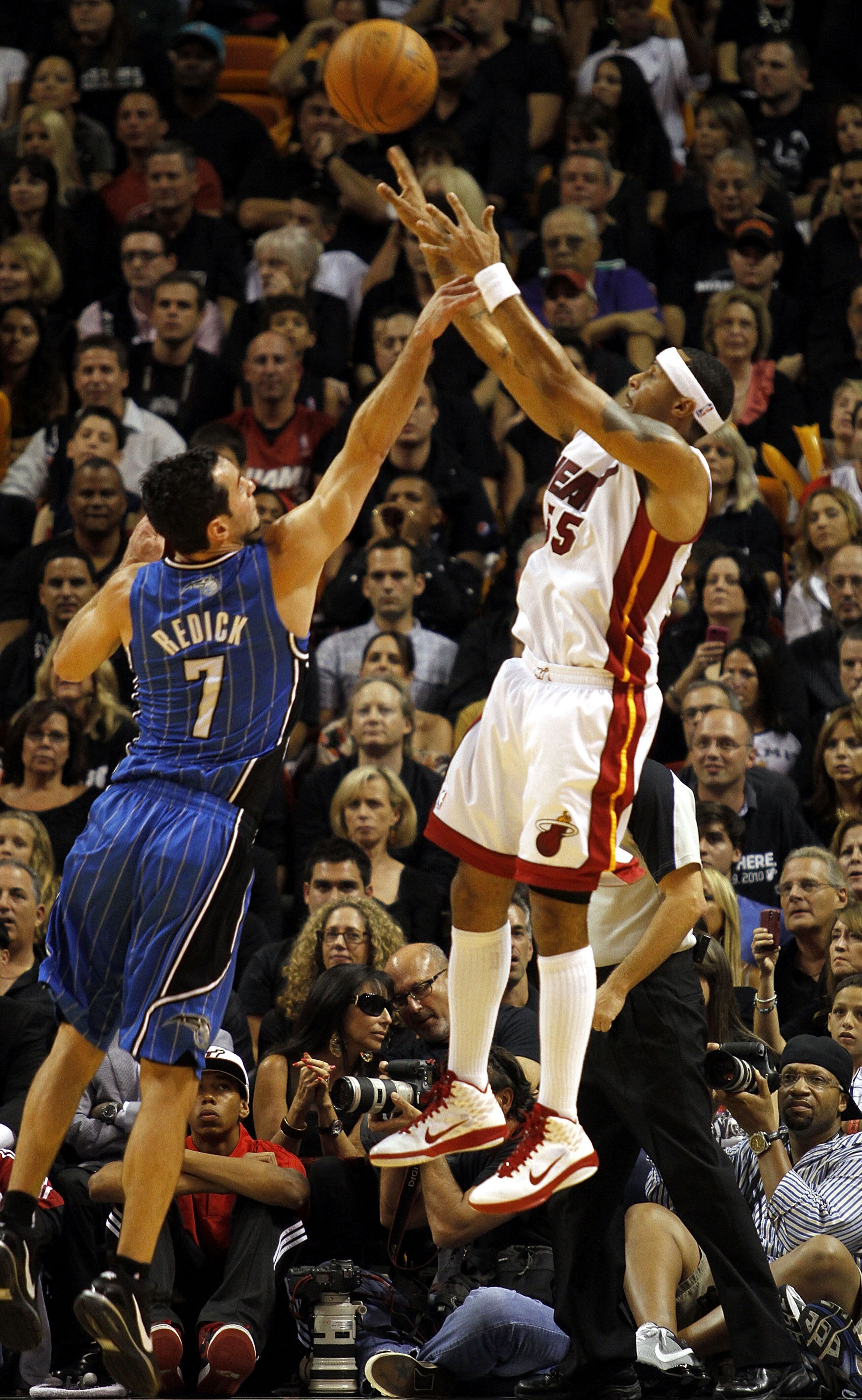 MIAMI - OCTOBER 29: Guard Eddie House #55 of the Miami Heat shoots against guard J.J. Redick #7 of the Orlando Magic at American Airlines Arena on October 29, 2010 in Miami, Florida. NOTE TO USER: User expressly acknowledges and agrees that, by download MIAMI - OCTOBER 29: Guard Eddie House #55 of the Miami Heat shoots against guard J.J. Redick #7 of the Orlando Magic at American Airlines Arena on October 29, 2010 in Miami, Florida. NOTE TO USER: User expressly acknowledges and agrees that, by download