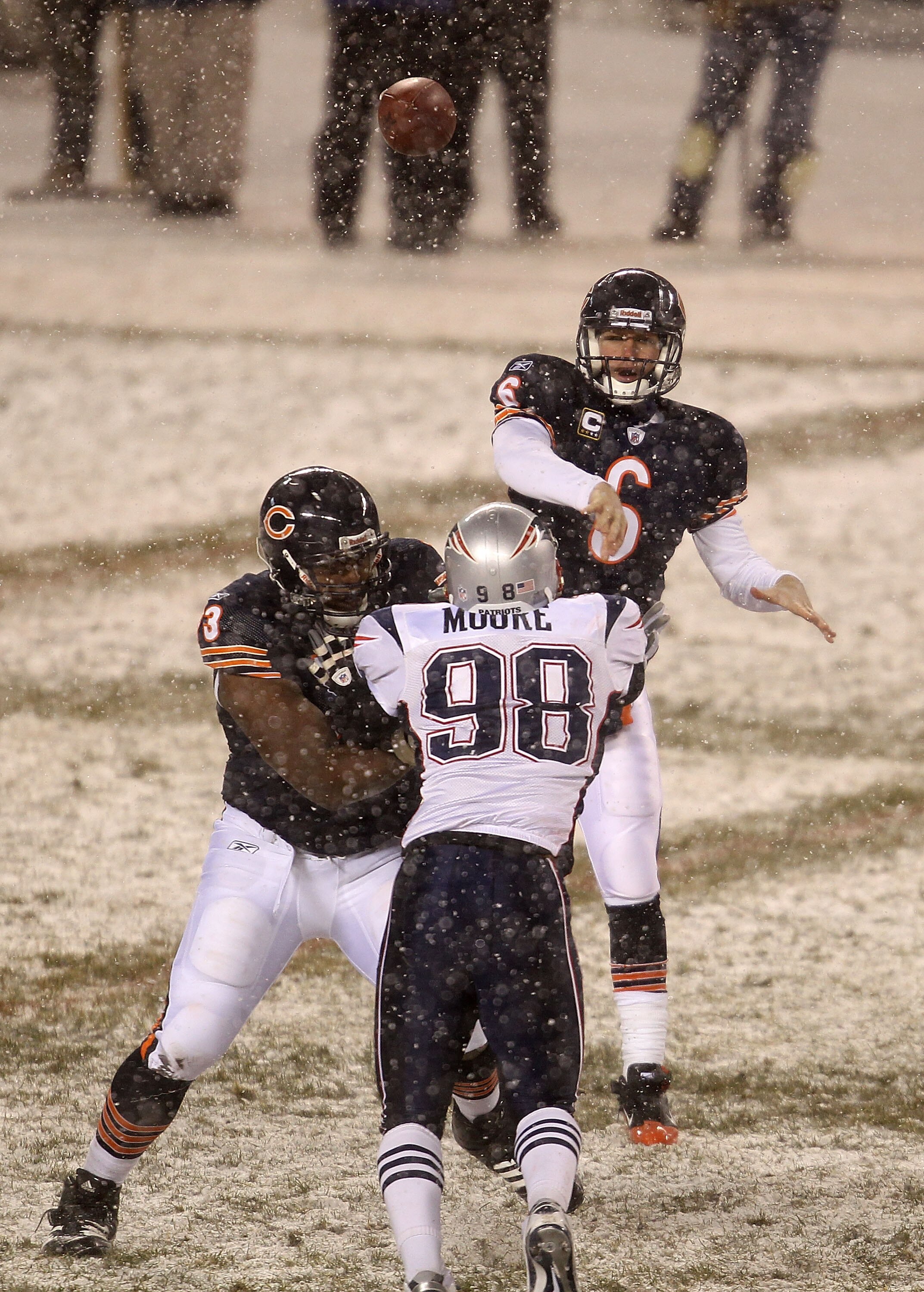 CHICAGO, IL - DECEMBER 12: Jay Cutler #6 of the Chicago Bears throws a pass as teammate J'Marcus Webb #73 blocks Eric Moore #98 of the New England Patriots at Soldier Field on December 12, 2010 in Chicago, Illinois. The Patriots defeated the Bears 36-7. (