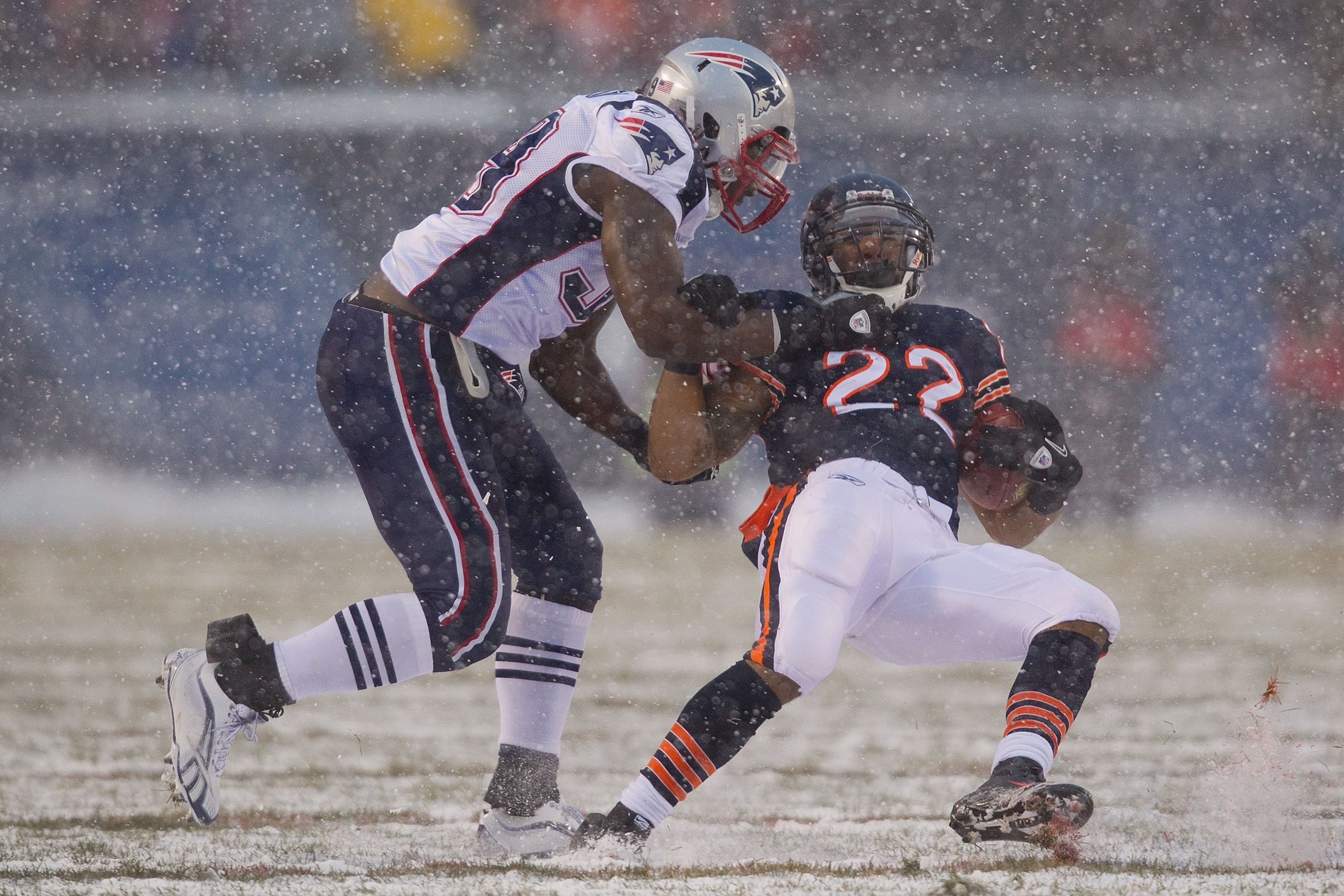 CHICAGO, IL - DECEMBER 12: Matt Forte #22 of the Chicago Bears is tackled by Mike Wright #99 of the New England Patriots at Soldier Field on December 12, 2010 in Chicago, Illinois. The Patriots beat the Bears 36-7. (Photo by Dilip Vishwanat/Getty Images CHICAGO, IL - DECEMBER 12: Matt Forte #22 of the Chicago Bears is tackled by Mike Wright #99 of the New England Patriots at Soldier Field on December 12, 2010 in Chicago, Illinois. The Patriots beat the Bears 36-7. (Photo by Dilip Vishwanat/Getty Images