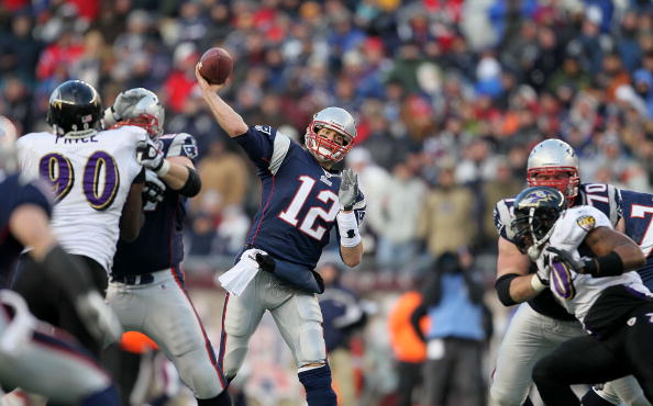 FOXBORO, MA - JANUARY 10:  Quarterback Tom Brady #12 of the New England Patriots throws a pass against the Baltimore Ravens during the 2010 AFC wild-card playoff game at Gillette Stadium on January 10, 2010 in Foxboro, Massachusetts.  (Photo by Jim Rogash