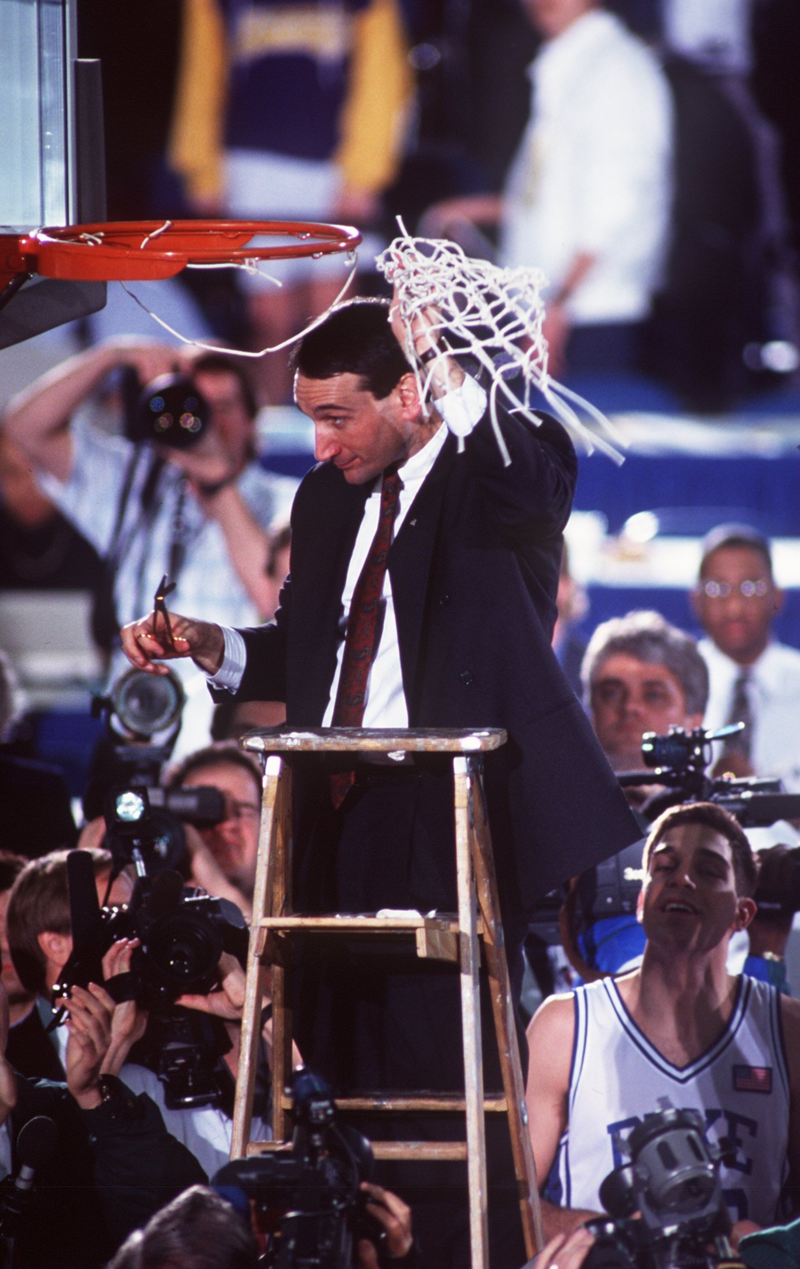 APR 1991:  MIKE KRZYZEWSKI, HEAD COACH OF DUKE BASKETBALL, CUTS DOWN THE NET AFTER WINNING THE NCAA NATIONAL CHAMPIONSHIP.   DUKE BEAT KANSAS 72-65 AT THE HOOSIER DOME, INDIANAPOLIS, INDIANA. Mandatory Credit: ALLSPORT USA/ALLSPORT