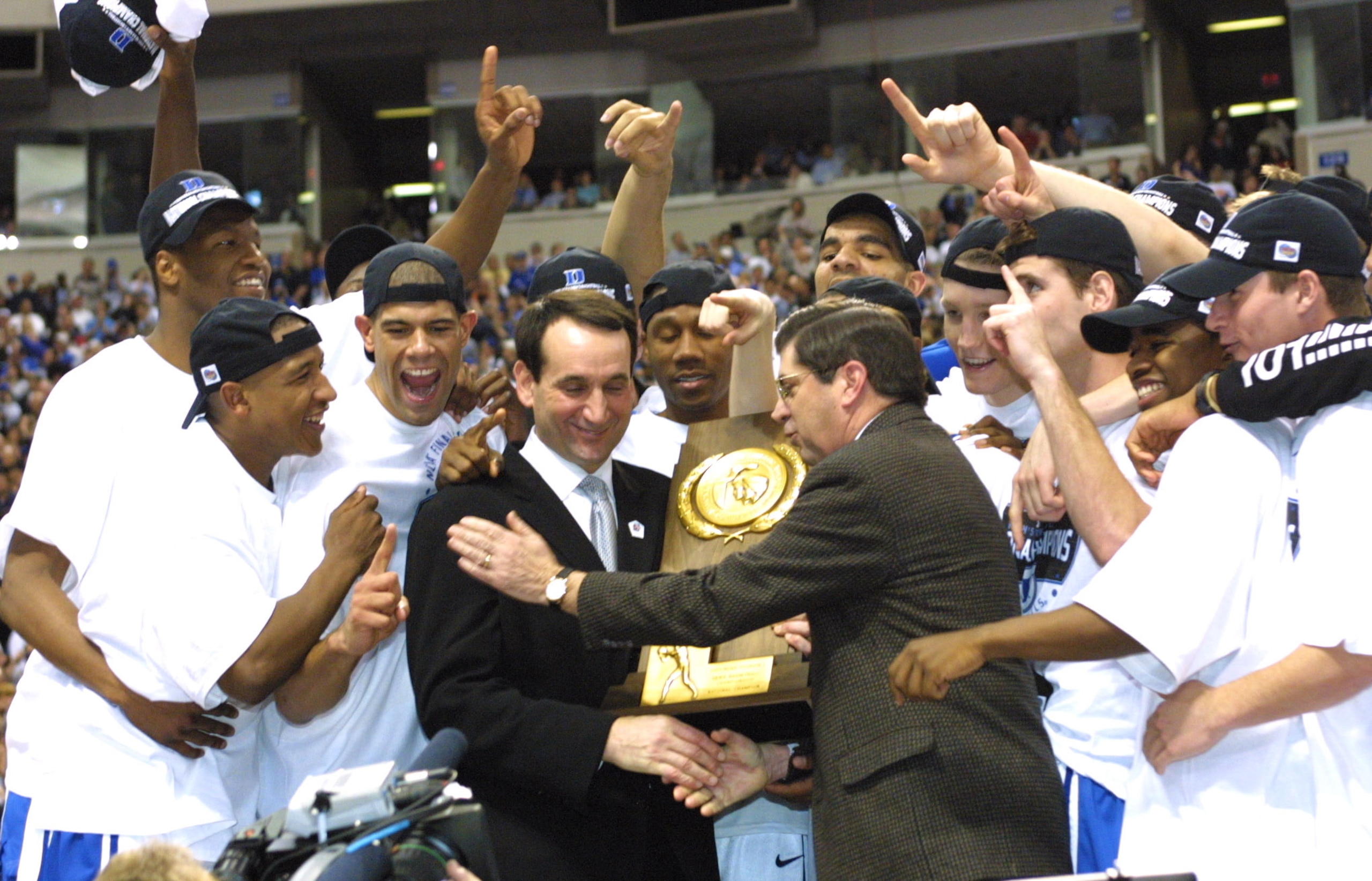 2 Apr 2001:  Head coach Mike Krzyzewski of Duke is presented with the trophy after defeating Arizona 82-72 in the NCAA National Championship Game of the Men's Final Four tournament at the Metrodome in Minneapolis, Minnesota.  DIGITAL IMAGE. Mandatory Cred