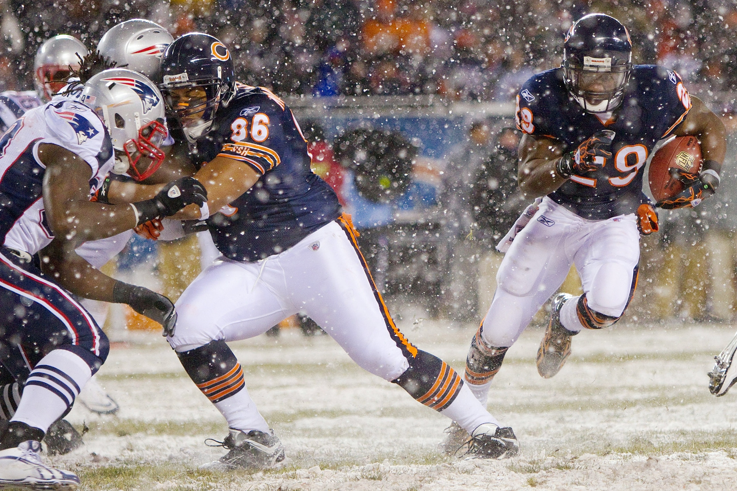 CHICAGO, IL - DECEMBER 12: Brandon Manumaleuna #86 of the Chicago Bears blocks for teammate Chester Taylor #29 al of the Chicago Bears against the New England Patriots at Soldier Field on December 12, 2010 in Chicago, Illinois.  The Patriots beat the Bear