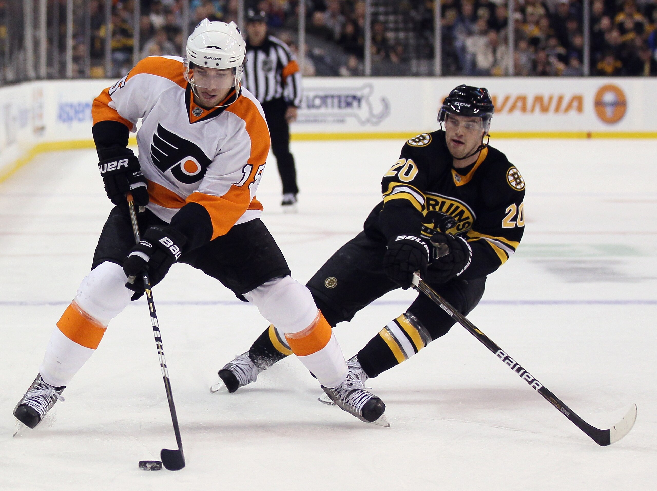 BOSTON, MA - DECEMBER 11:  Andres Nodl #15 of the Philadelphia Flyers takes the puck as Daniel Paille #20 of the Boston Bruins defends on December 11, 2010 at the TD Garden in Boston, Massachusetts.  (Photo by Elsa/Getty Images)