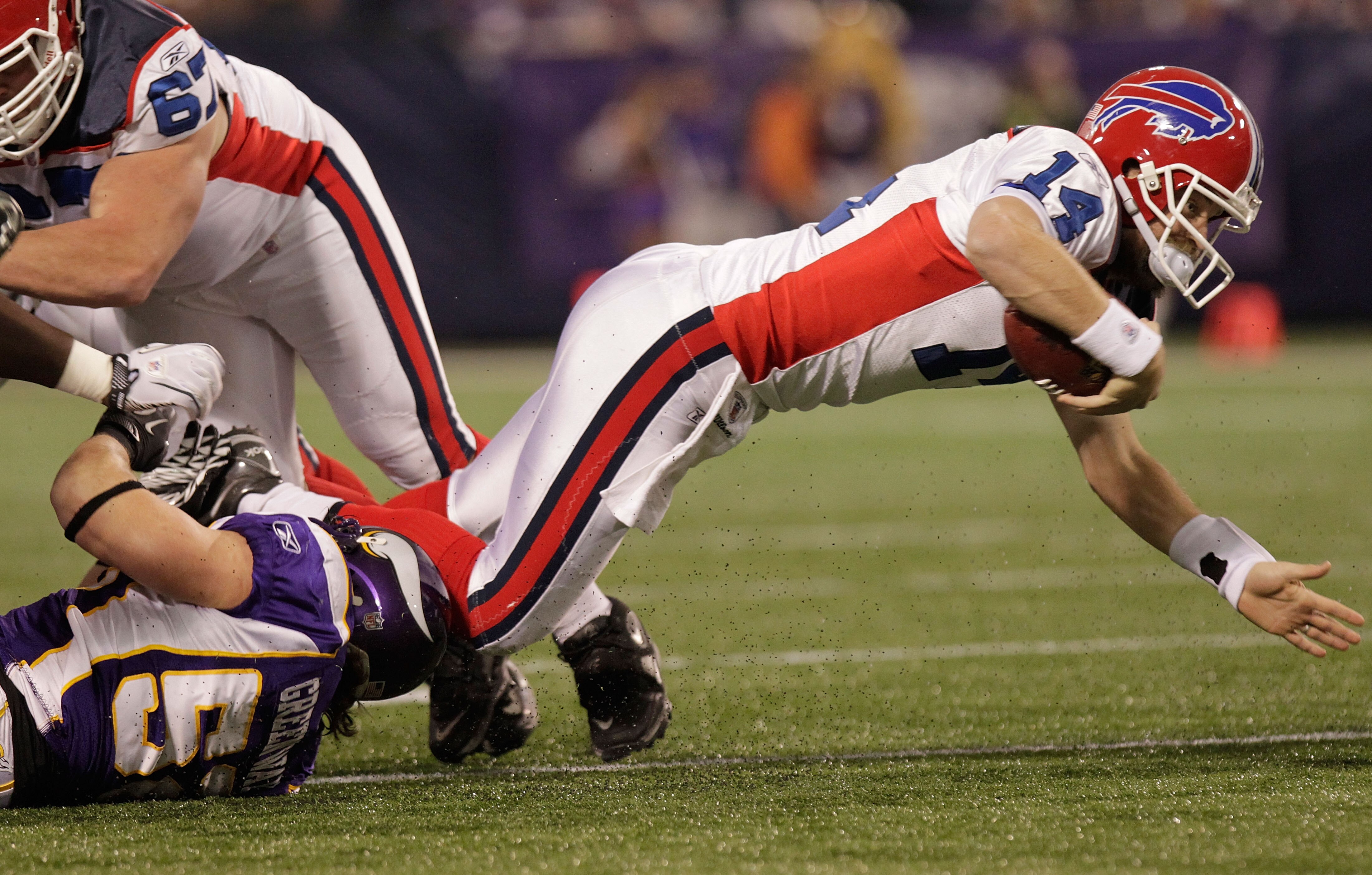 MINNEAPOLIS, MN - DECEMBER 05:  Ryan Fitzpatrick #14 of the Buffalo Bills dives but fails to convert a first down against the Minnesota Vikings at the Mall of America Field at the Hubert H. Humphrey Metrodome on December 5, 2010 in Minneapolis, Minnesota.