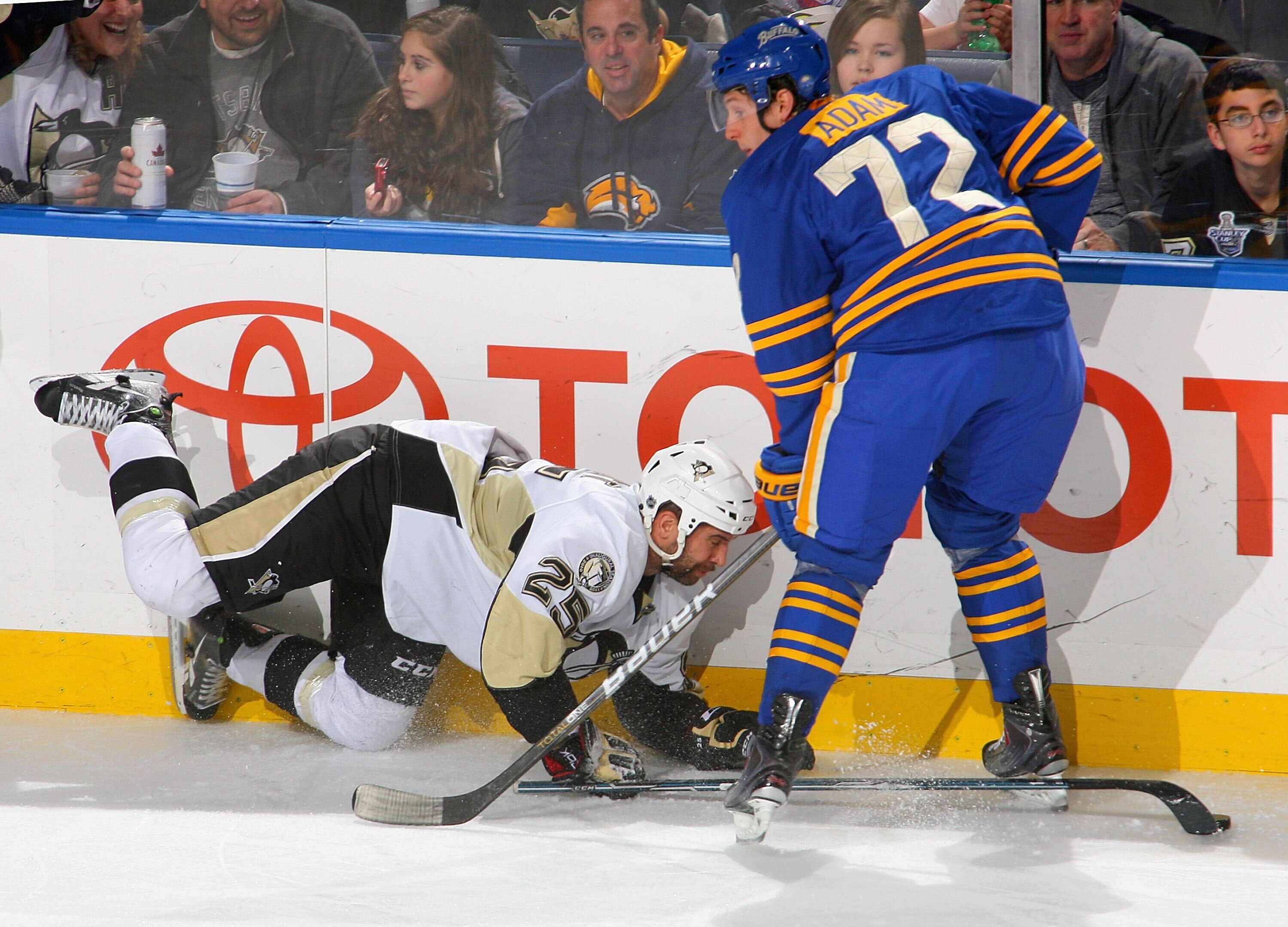 BUFFALO, NY - DECEMBER 11: Maxime Talbot #25 of the Pittsburgh Penguins falls into Luke Adam #72 of the Buffalo Sabres at HSBC Arena on December 11, 2010 in Buffalo, New York.  (Photo by Rick Stewart/Getty Images)