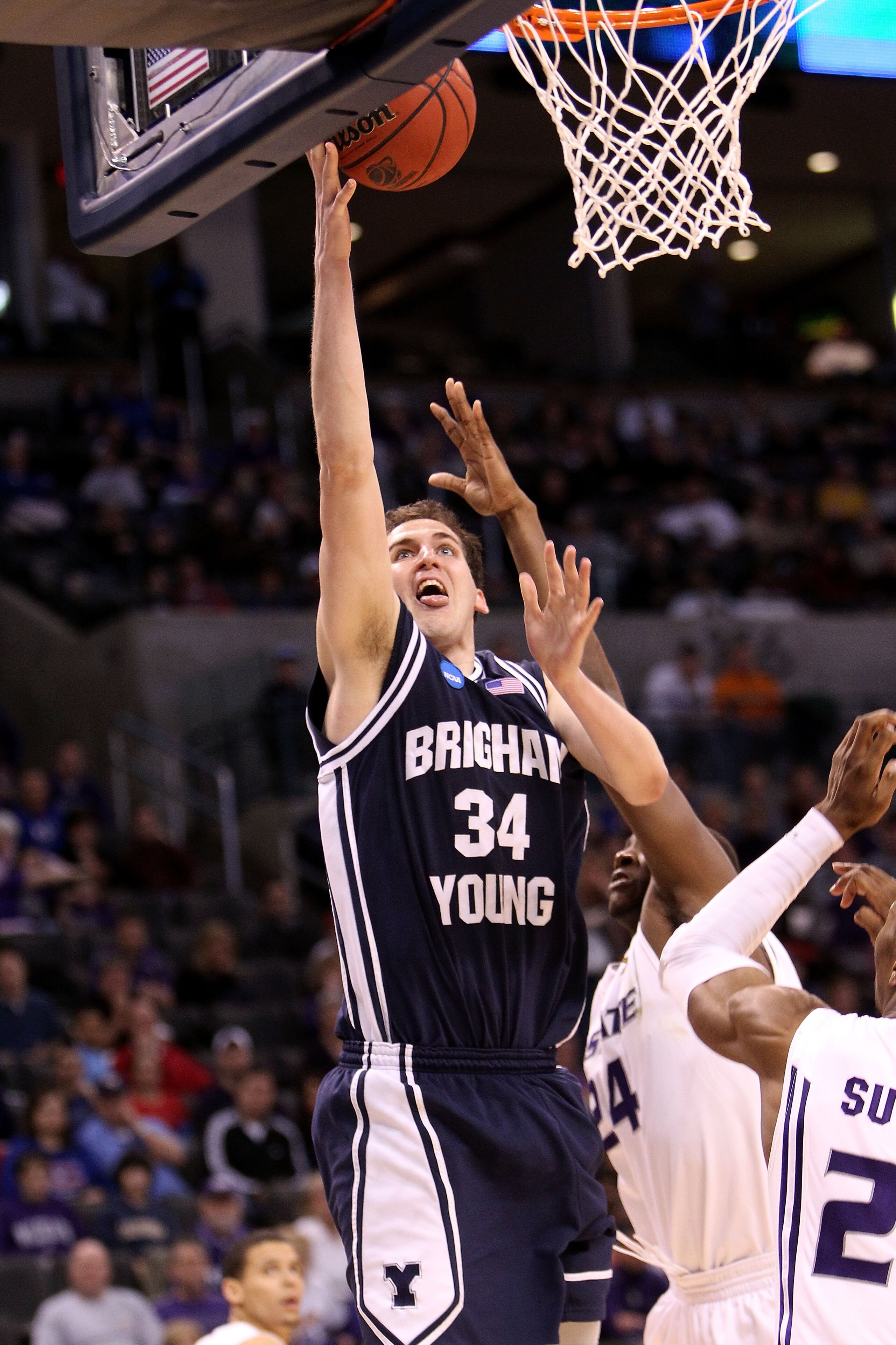 OKLAHOMA CITY - MARCH 20:  Noah Hartsock #34 of the Brigham Young Cougars attempts a shot against the Kansas State Wildcats during the second round of the 2010 NCAA men's basketball tournament at Ford Center on March 20, 2010 in Oklahoma City, Oklahoma.