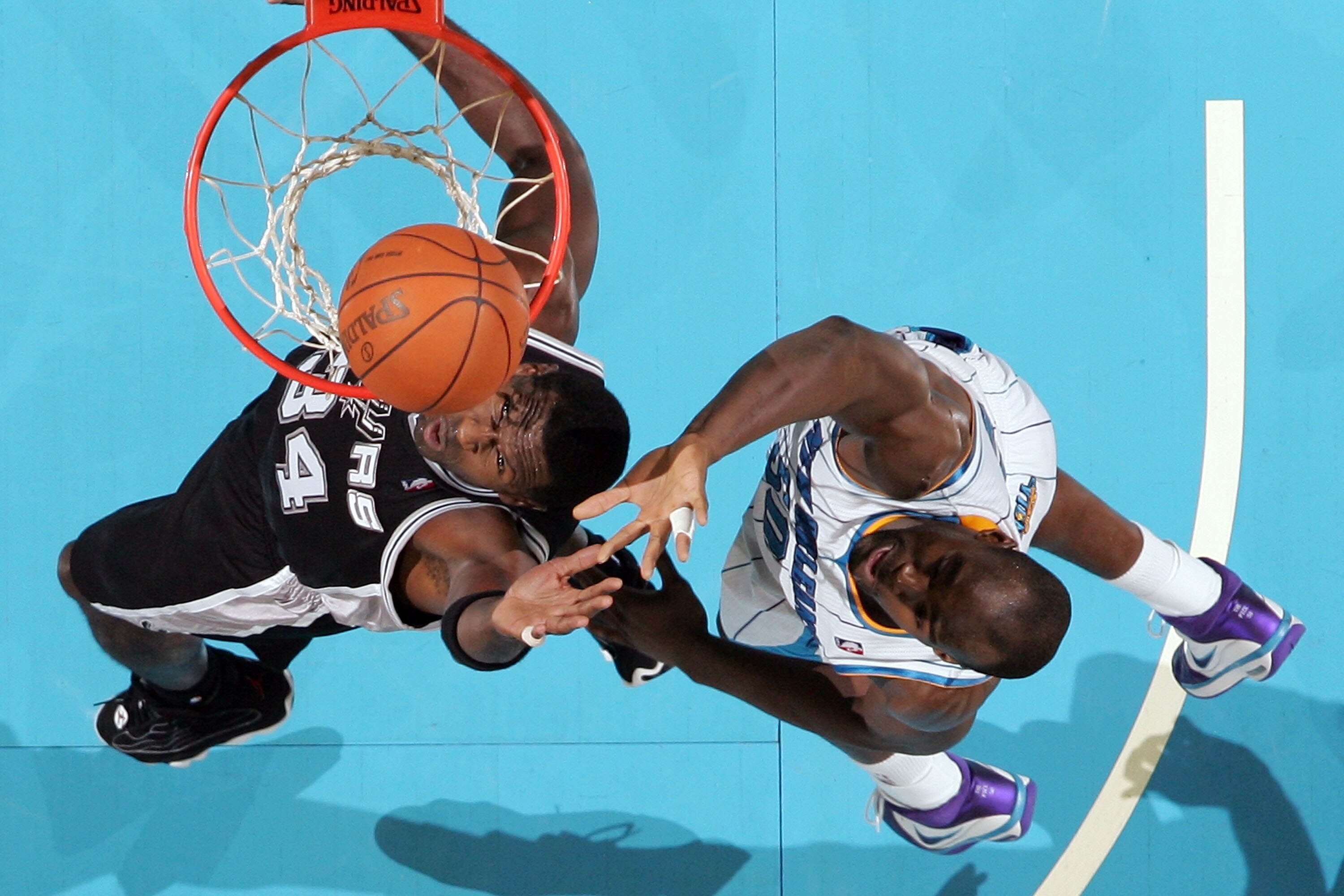 NEW ORLEANS - NOVEMBER 28: Antonio McDyess #34 of the San Antonio Spurs shoots the ball over Emeka Okafor #50 of the New Orleans Hornets at the New Orleans Arena on November 28, 2010 in New Orleans, Louisiana.  The Spurs defeated the Hornets 109-95.  NOTE