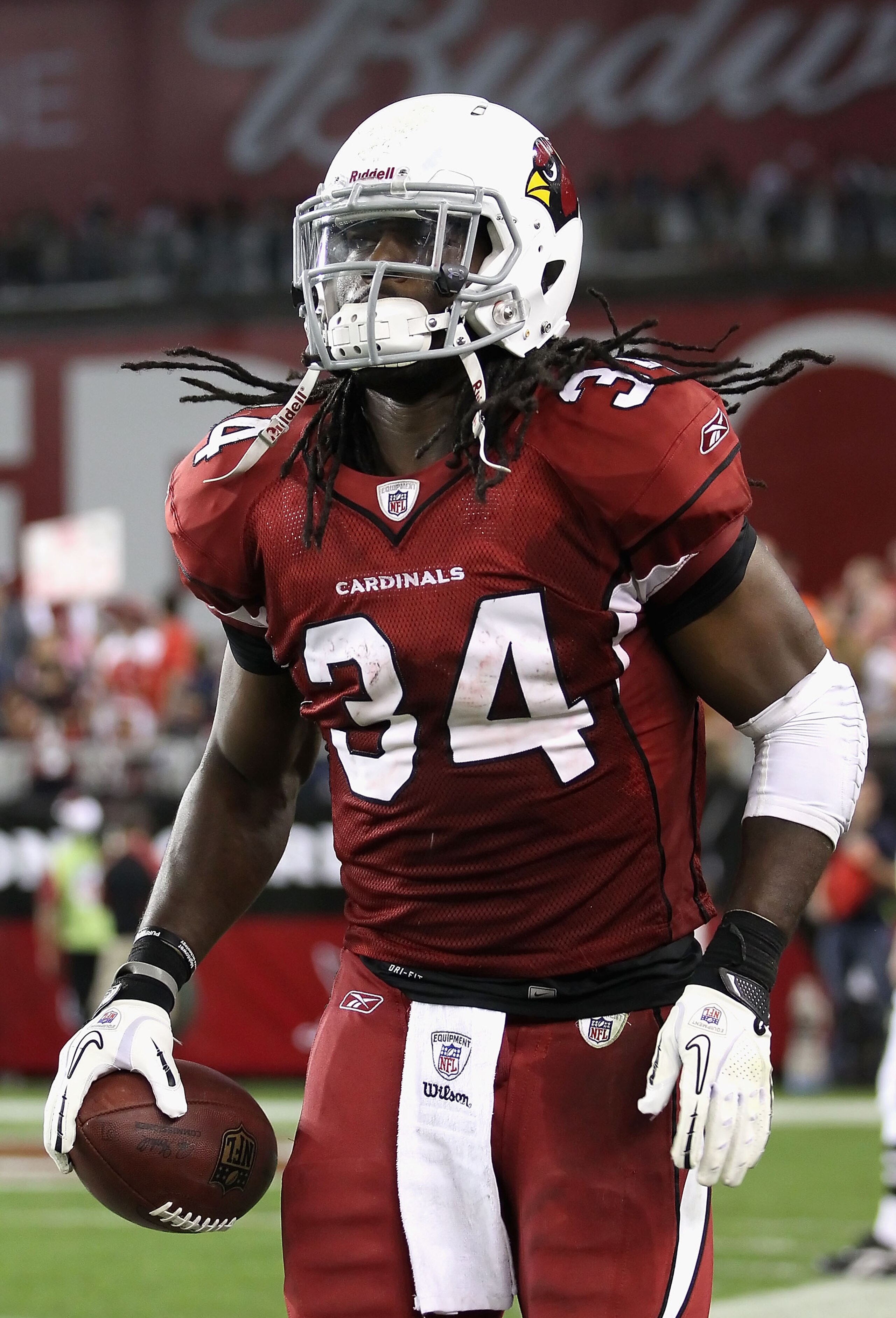 GLENDALE, AZ - DECEMBER 12:  Runningback Tim Hightower #34 of the Arizona Cardinals reacts after scoring a 35 yard rushing touchdown against the Denver Broncos during the fourth quarter of the NFL game at the University of Phoenix Stadium on December 12,