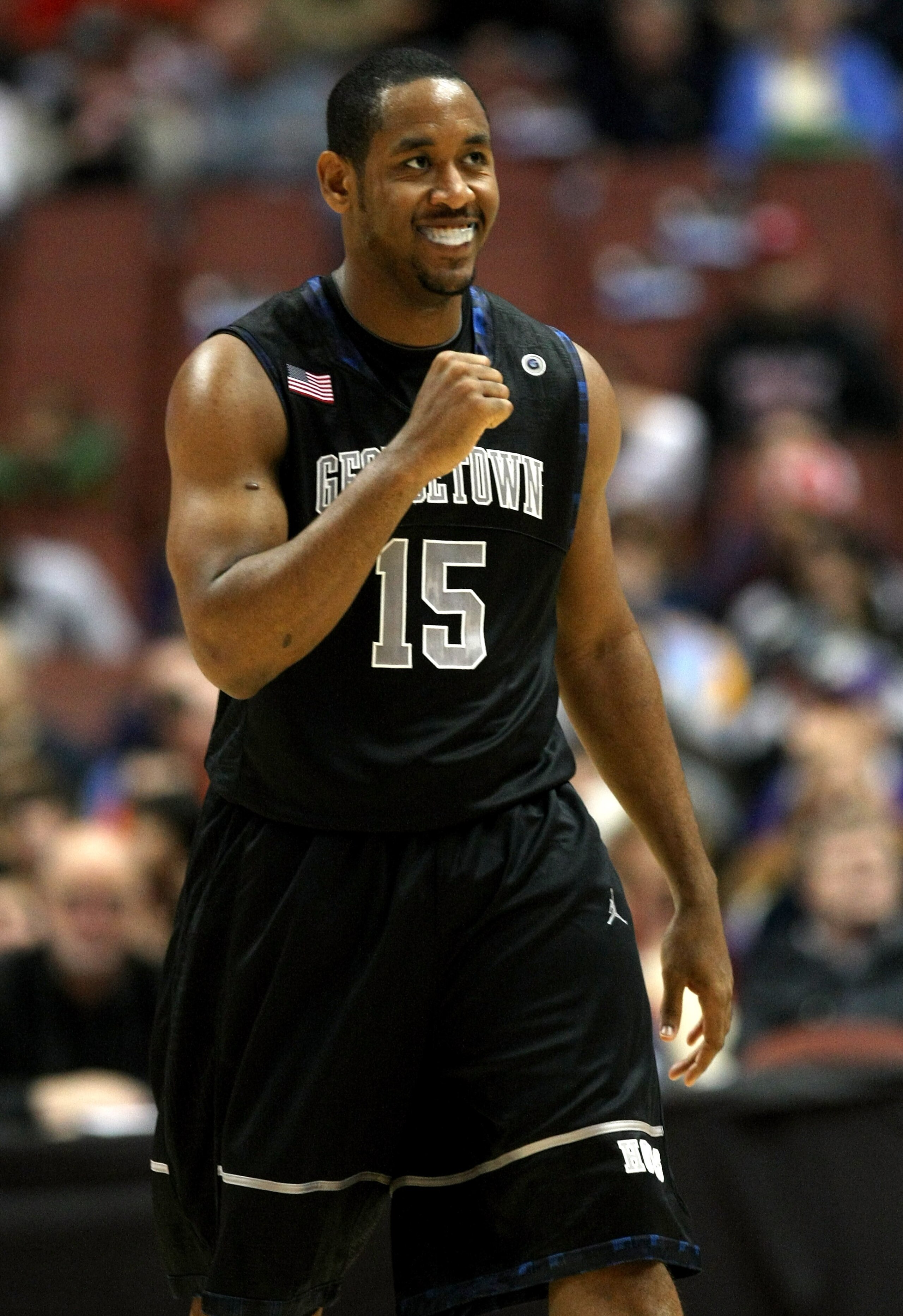 ANAHEIM, CA - DECEMBER 12: Austin Freeman #15 of the Georgetown Hoyas celebrates during the game with the Washington Huskies in the John Wooden Classic on December 12, 2009 at the Honda Center in Anaheim, California. Georgetown won 74-66. (Photo by Stephe