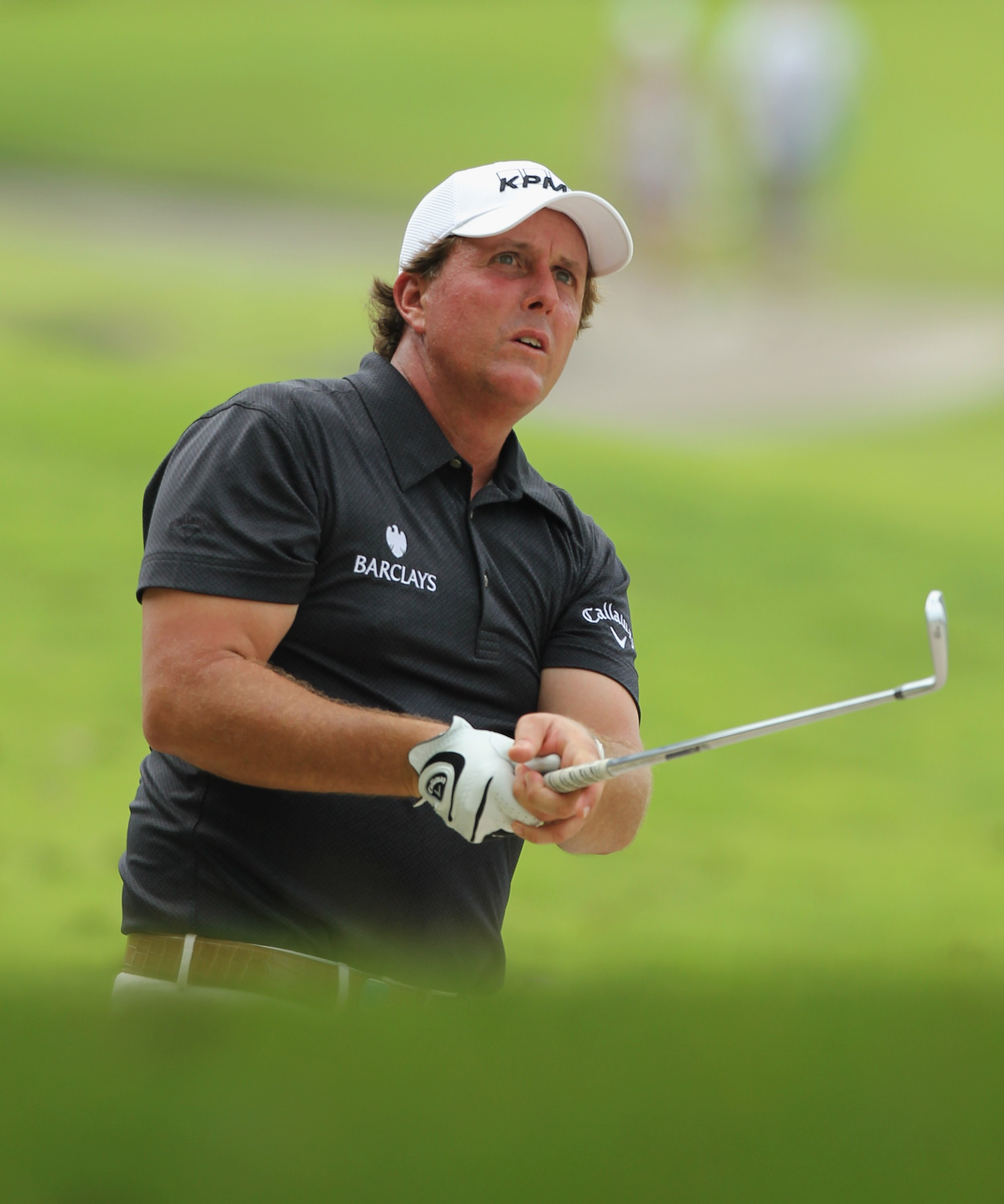SINGAPORE - NOVEMBER 13: Phil Mickelson of USA watches his 2nd shot on the 18th hole during the Third Round of the Barclays Singapore Open held at the Sentosa Golf Club on November 13, 2010 in Singapore, Singapore.  (Photo by Stanley Chou/Getty Images)