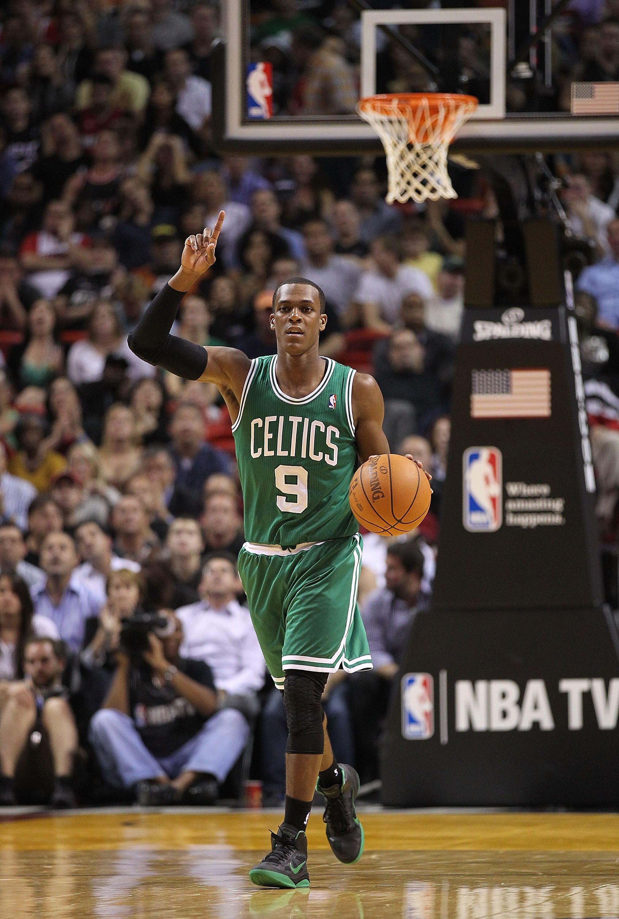 MIAMI - NOVEMBER 11:  Rajon Rondo #9 of the Boston Celtics brings the ball up the court during a game against the Miami Heat at American Airlines Arena on November 11, 2010 in Miami, Florida. NOTE TO USER: User expressly acknowledges and agrees that, by d