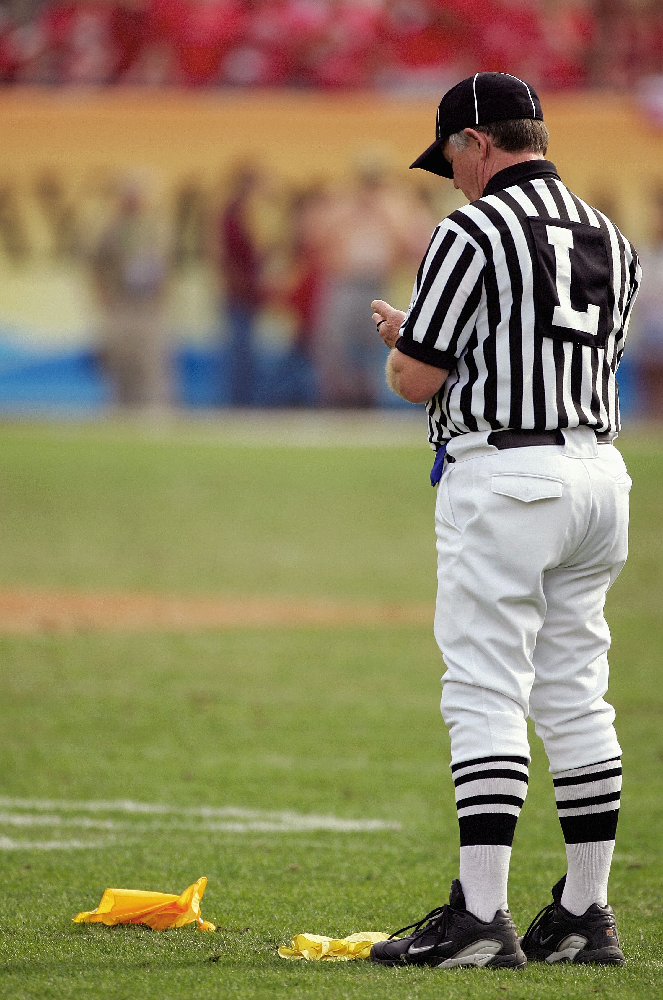 TAMPA, FL-  JANUARY 1:  A referee throws a flag during the Outback Bowl game between the Wisconsin Badgers and Georgia Bulldogs at Raymond James Stadium on January 1, 2005 in Tampa, Florida. Georgia won the game 24-21. (Photo by Scott Halleran/Getty Image