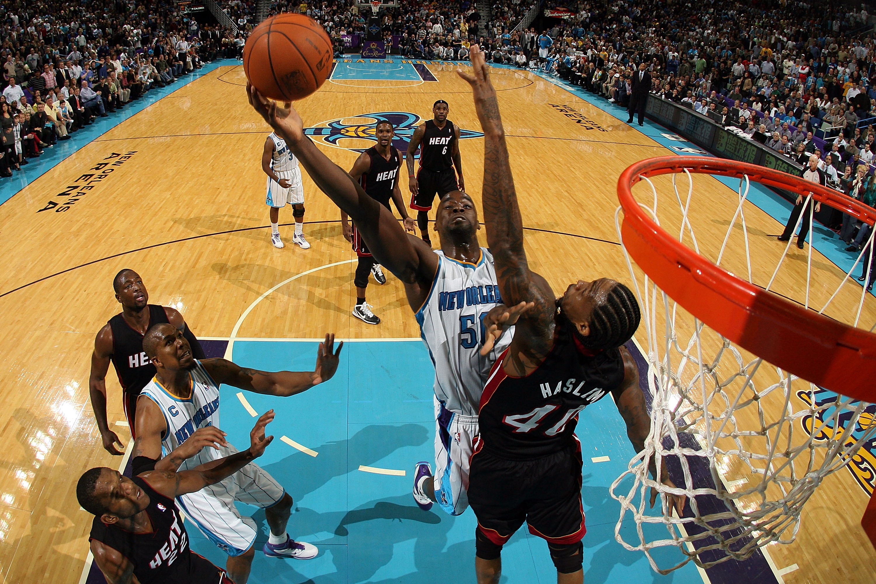 NEW ORLEANS - NOVEMBER 05:  Emeka  Okafor #50 of the New Orleans Hornets shoots the ball over Udonis Haslem #40 of the Miami Heat at the New Orleans Arena on November 5, 2010 in New Orleans, Louisiana.  The Hornets defeated the Heat 96-93.  NOTE TO USER: