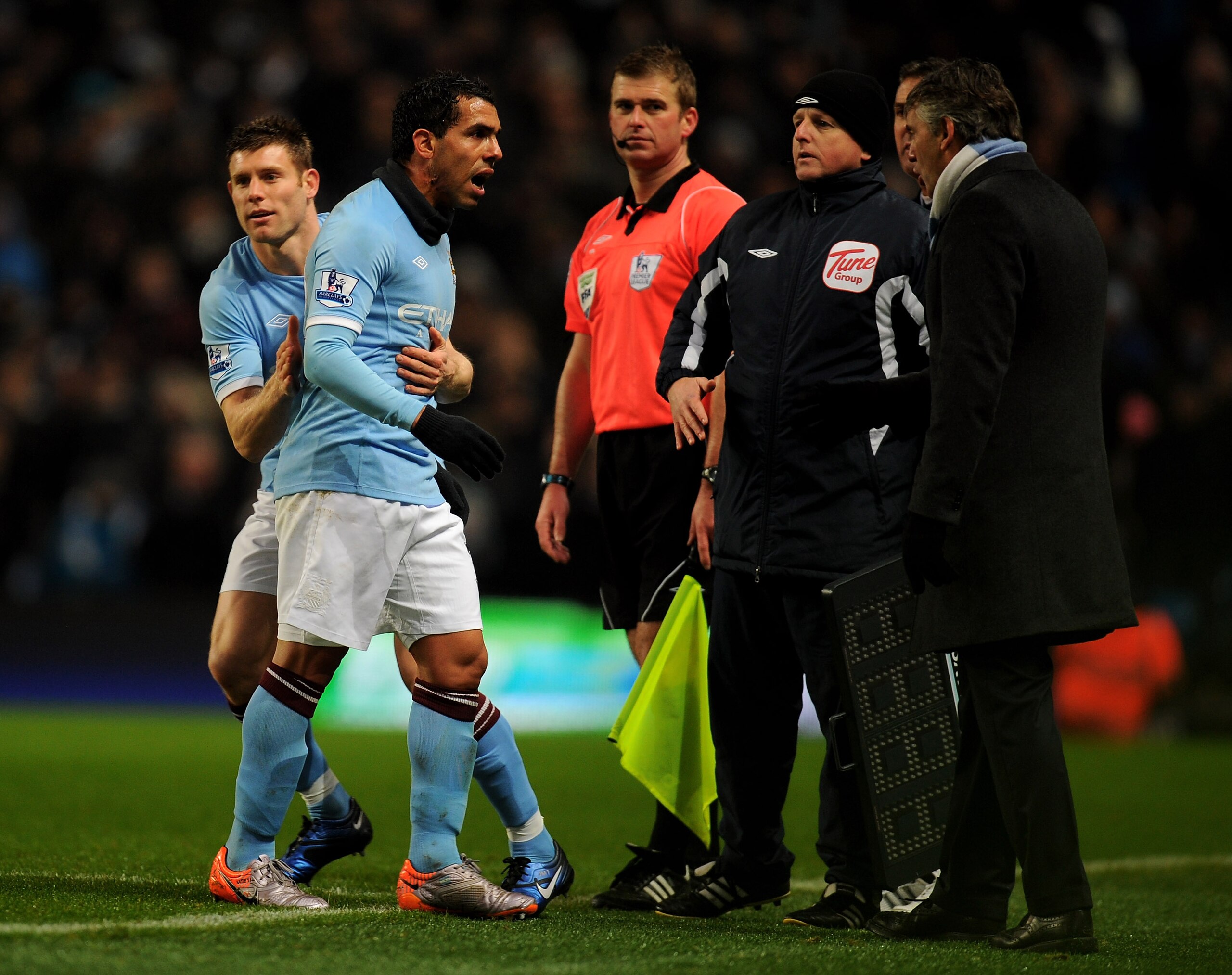 MANCHESTER, ENGLAND - DECEMBER 04: Carlos Tevez of Manchester City has words with Manchester City Manager Roberto Mancini after being substituted for team mate James Milner during the Barclays Premier League match between Manchester City and Bolton Wande MANCHESTER, ENGLAND - DECEMBER 04: Carlos Tevez of Manchester City has words with Manchester City Manager Roberto Mancini after being substituted for team mate James Milner during the Barclays Premier League match between Manchester City and Bolton Wande