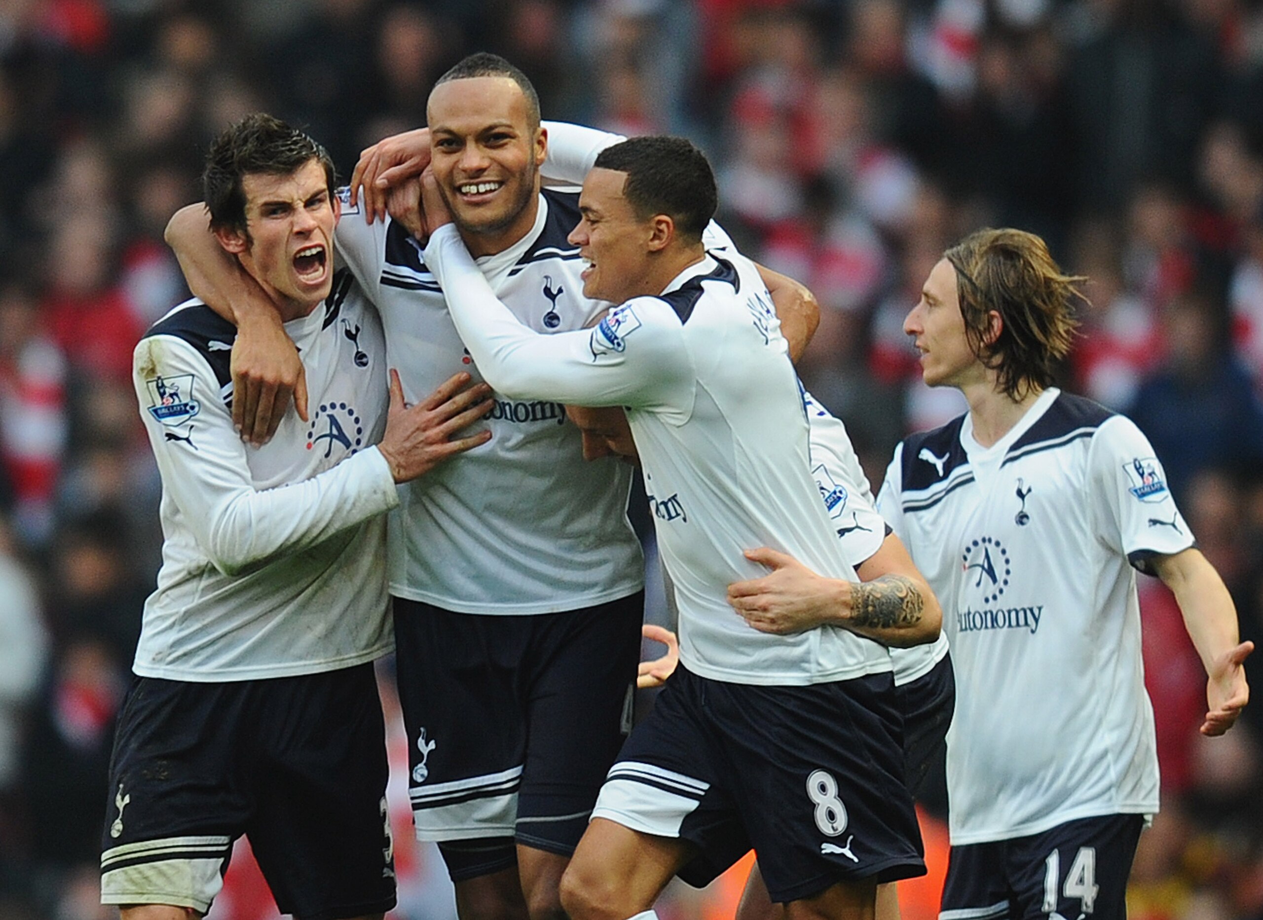 LONDON, ENGLAND - NOVEMBER 20: Younes Kaboul of Tottenham celebrates with team mates Gareth Bale and Jermaine Jenas after scoring the winner during the Barclays Premier League match between Arsenal and Tottenham Hotspur at the Emirates Stadium on Novembe LONDON, ENGLAND - NOVEMBER 20: Younes Kaboul of Tottenham celebrates with team mates Gareth Bale and Jermaine Jenas after scoring the winner during the Barclays Premier League match between Arsenal and Tottenham Hotspur at the Emirates Stadium on Novembe