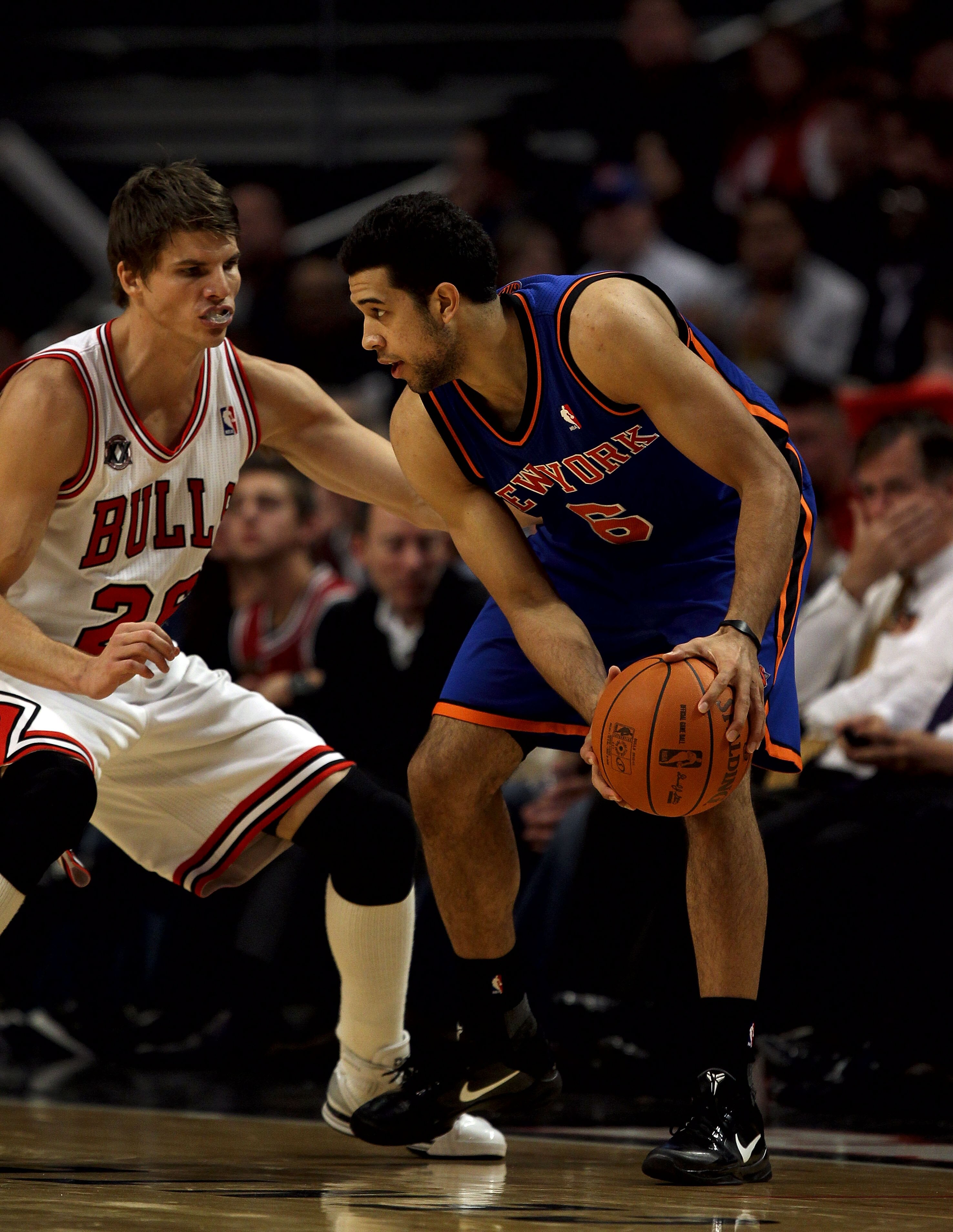 CHICAGO - NOVEMBER 04: Landry Fields #6 of the New York Knicks looks to move against Kyle Korver #26 of the Chicago Bulls at the United Center on November 4, 2010 in Chicago, Illinois. The Knicks defeated the Bulls 120-112. NOTE TO USER: User expressly ac