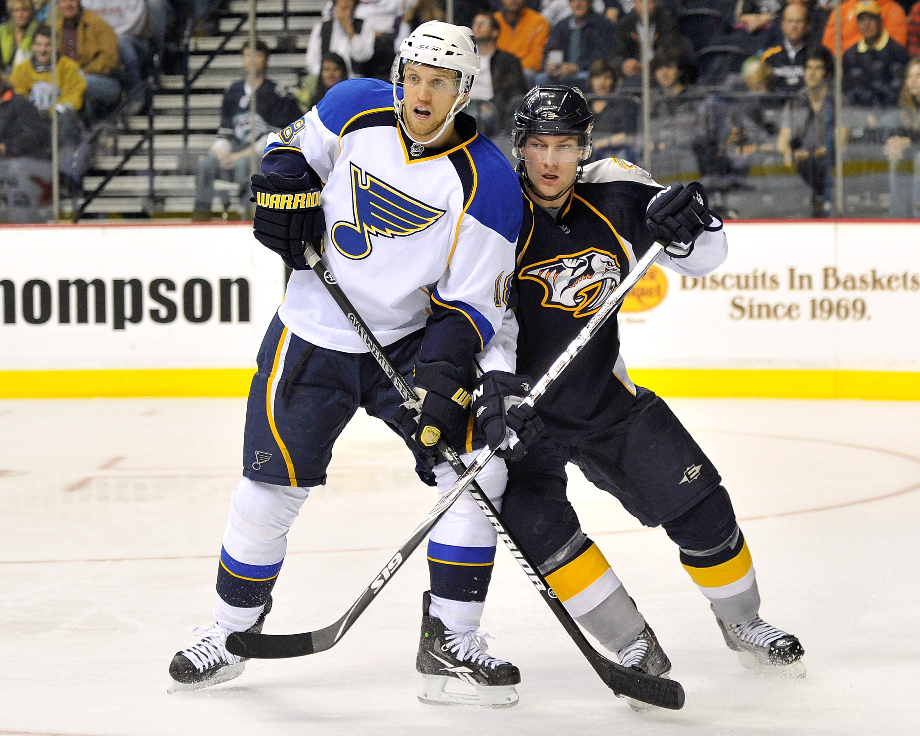 NASHVILLE, TN - OCTOBER 28:  Kevin Klein #8 of the Nashville Predators fights for defensive position on Jay McClement #18 of the St. Louis Blues on October 28, 2010 at Bridgestone Arena in Nashville, Tennessee.  (Photo by Frederick Breedon/Getty Images)