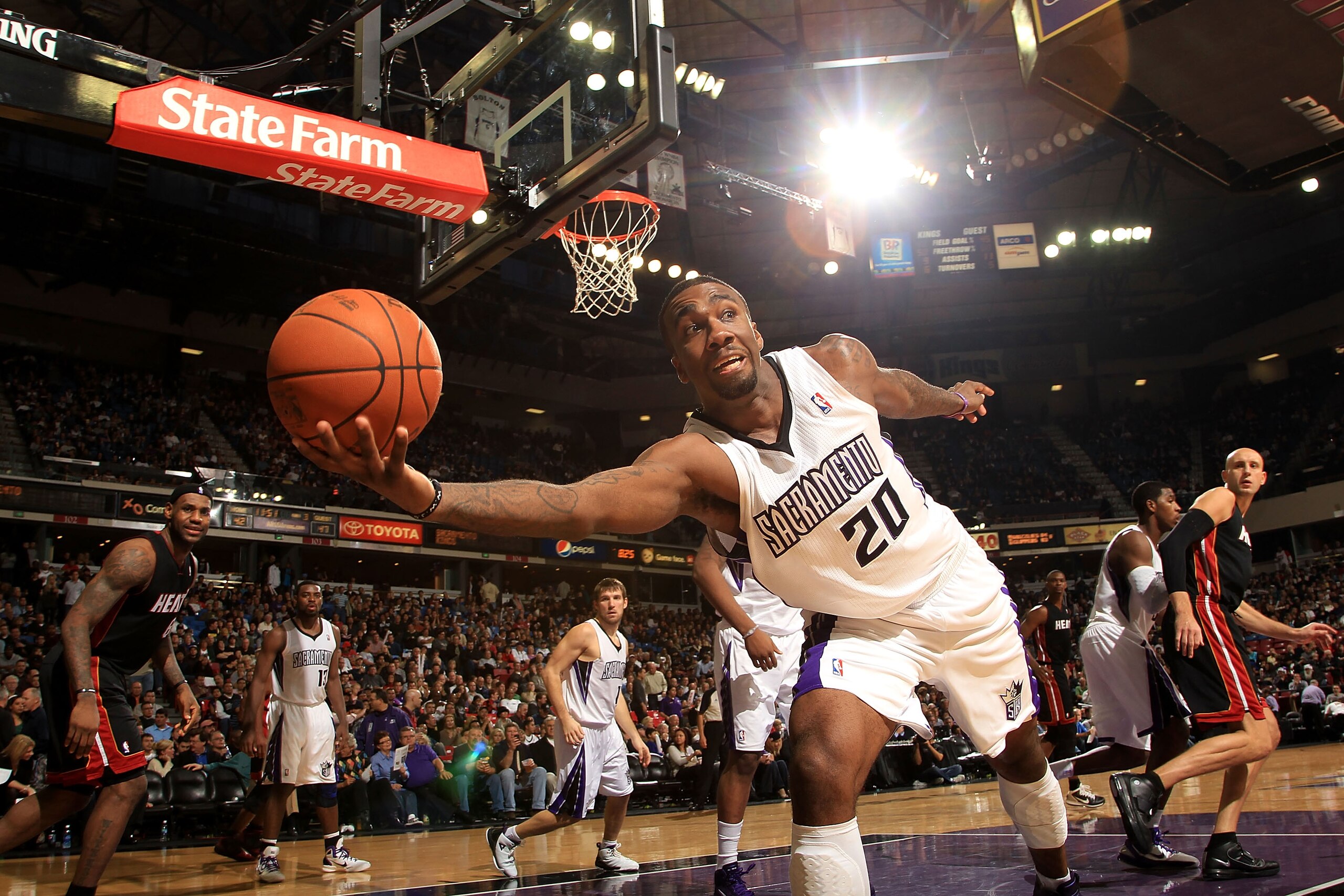 SACRAMENTO, CA - DECEMBER 11:  Donte Greene #20 the Sacramento Kings saves the ball from going out of bounds during their game against the Miami Heat at ARCO Arena on December 11, 2010 in Sacramento, California.  NOTE TO USER: User expressly acknowledges