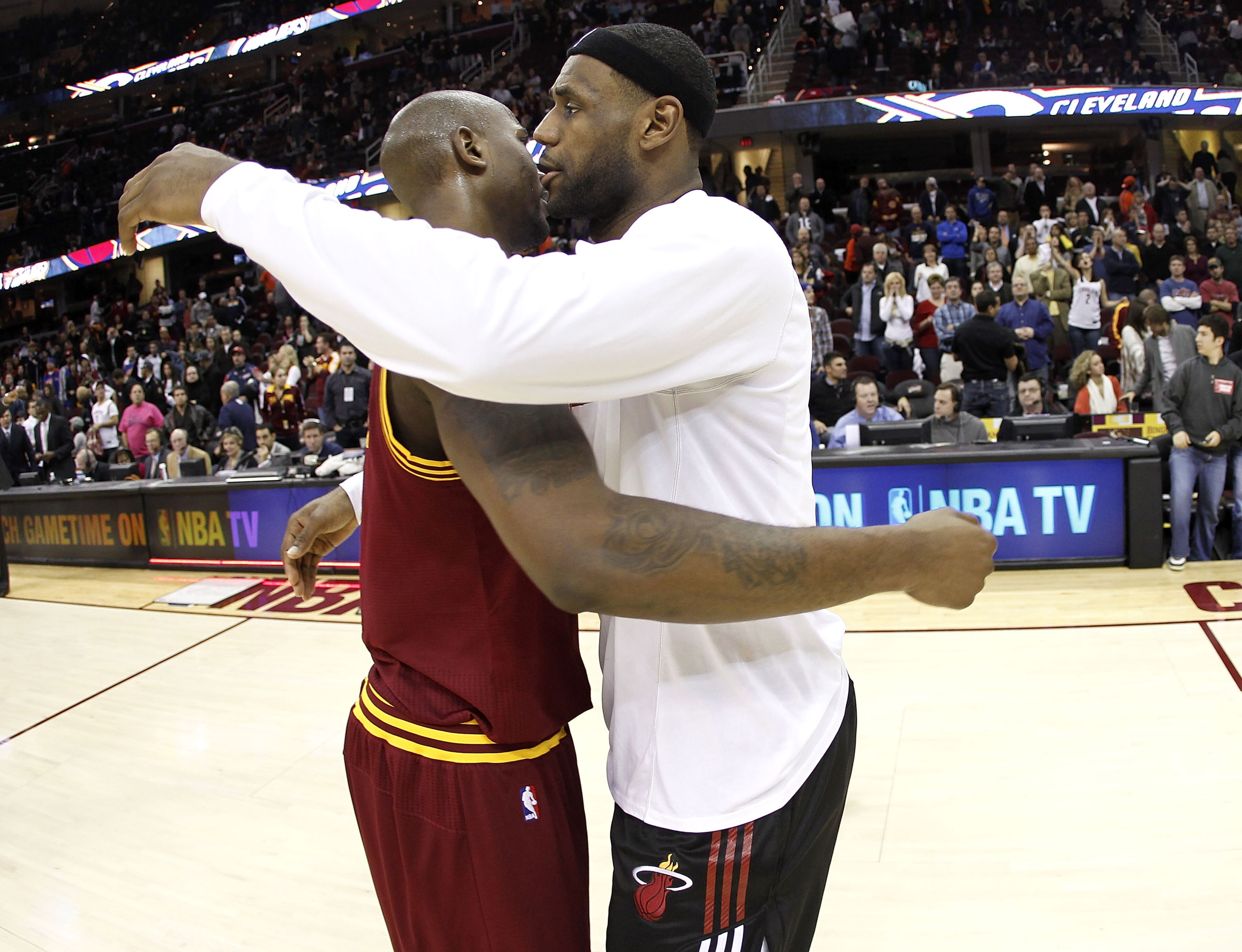 CLEVELAND, OH - DECEMBER 02: LeBron James #6 of the Miami Heat hugs Jawad Williams after a 118-90 victory over the Cleveland Cavaliers at Quicken Loans Arena on December 2, 2010 in Cleveland, Ohio. NOTE TO USER: User expressly acknowledges and agrees tha CLEVELAND, OH - DECEMBER 02: LeBron James #6 of the Miami Heat hugs Jawad Williams after a 118-90 victory over the Cleveland Cavaliers at Quicken Loans Arena on December 2, 2010 in Cleveland, Ohio. NOTE TO USER: User expressly acknowledges and agrees tha