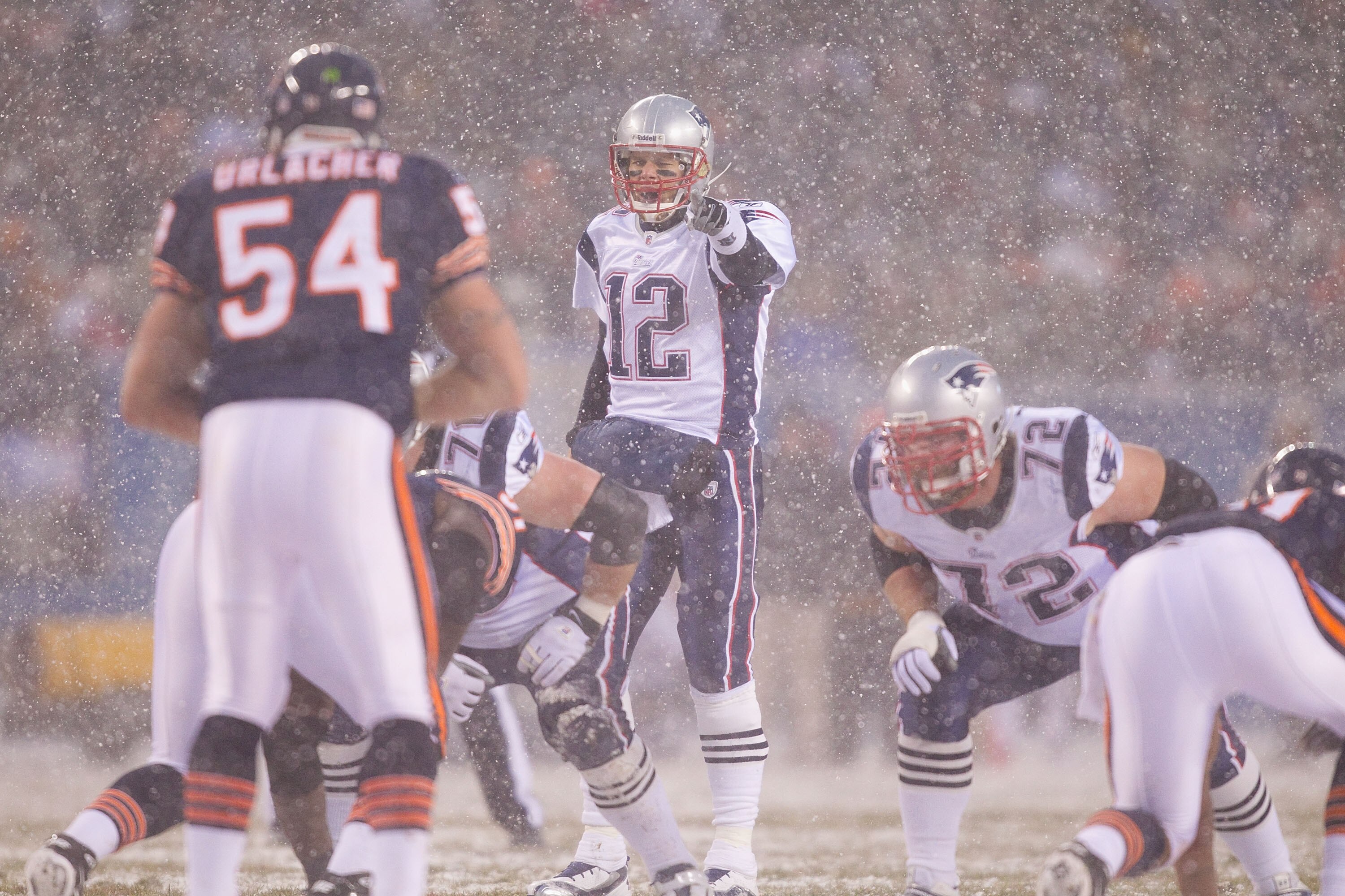 CHICAGO, IL - DECEMBER 12: Tom Brady #12 of the New England Patriots directs the offense against the Chicago Bears at Soldier Field on December 12, 2010 in Chicago, Illinois.  The Patriots beat the Bears 36-7.  (Photo by Dilip Vishwanat/Getty Images)
