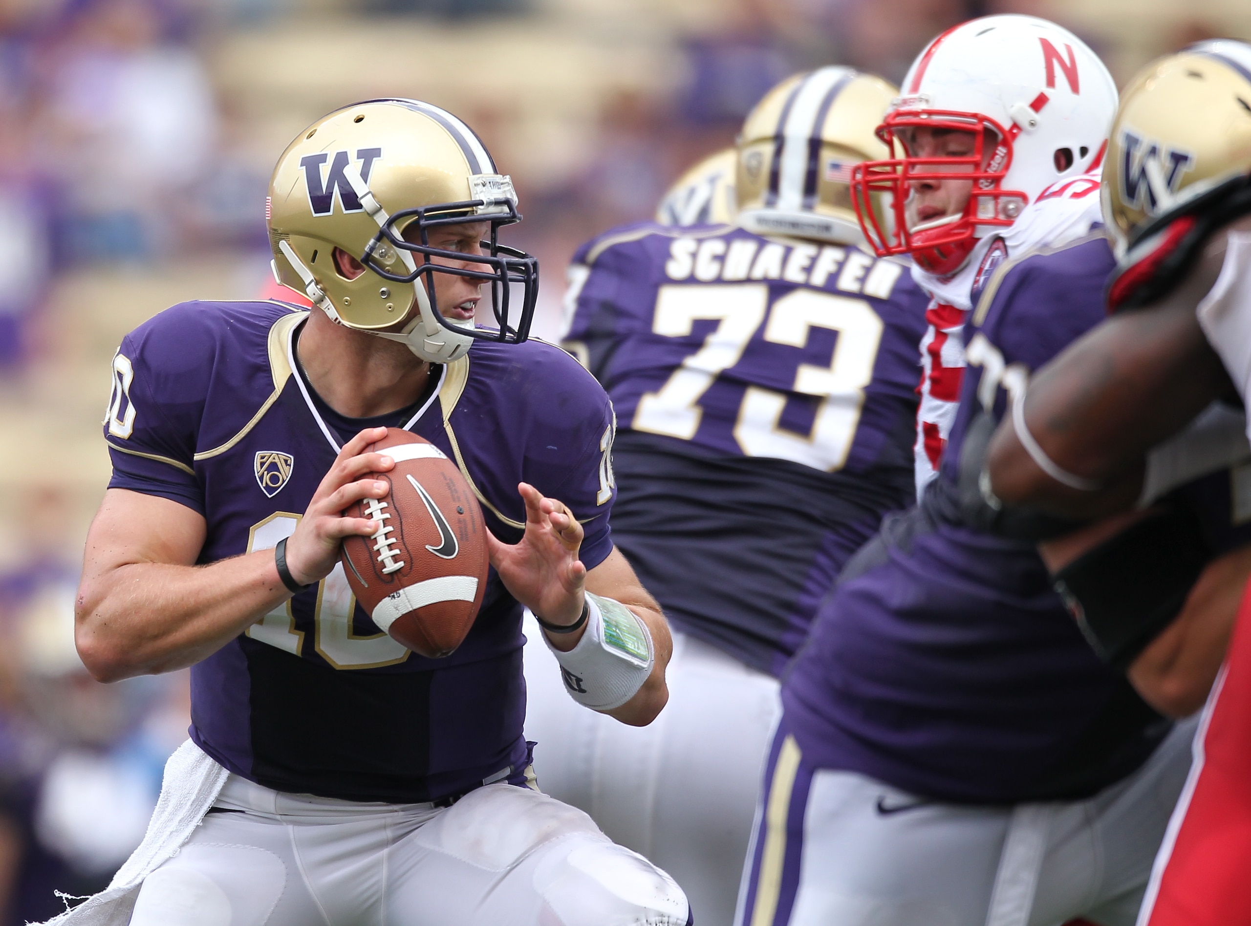 SEATTLE - SEPTEMBER 18: Quarterback Jake Locker #10 of the Washington Huskies looks downfield against the Nebraska Cornhuskers on September 18, 2010 at Husky Stadium in Seattle, Washington. (Photo by Otto Greule Jr/Getty Images)
