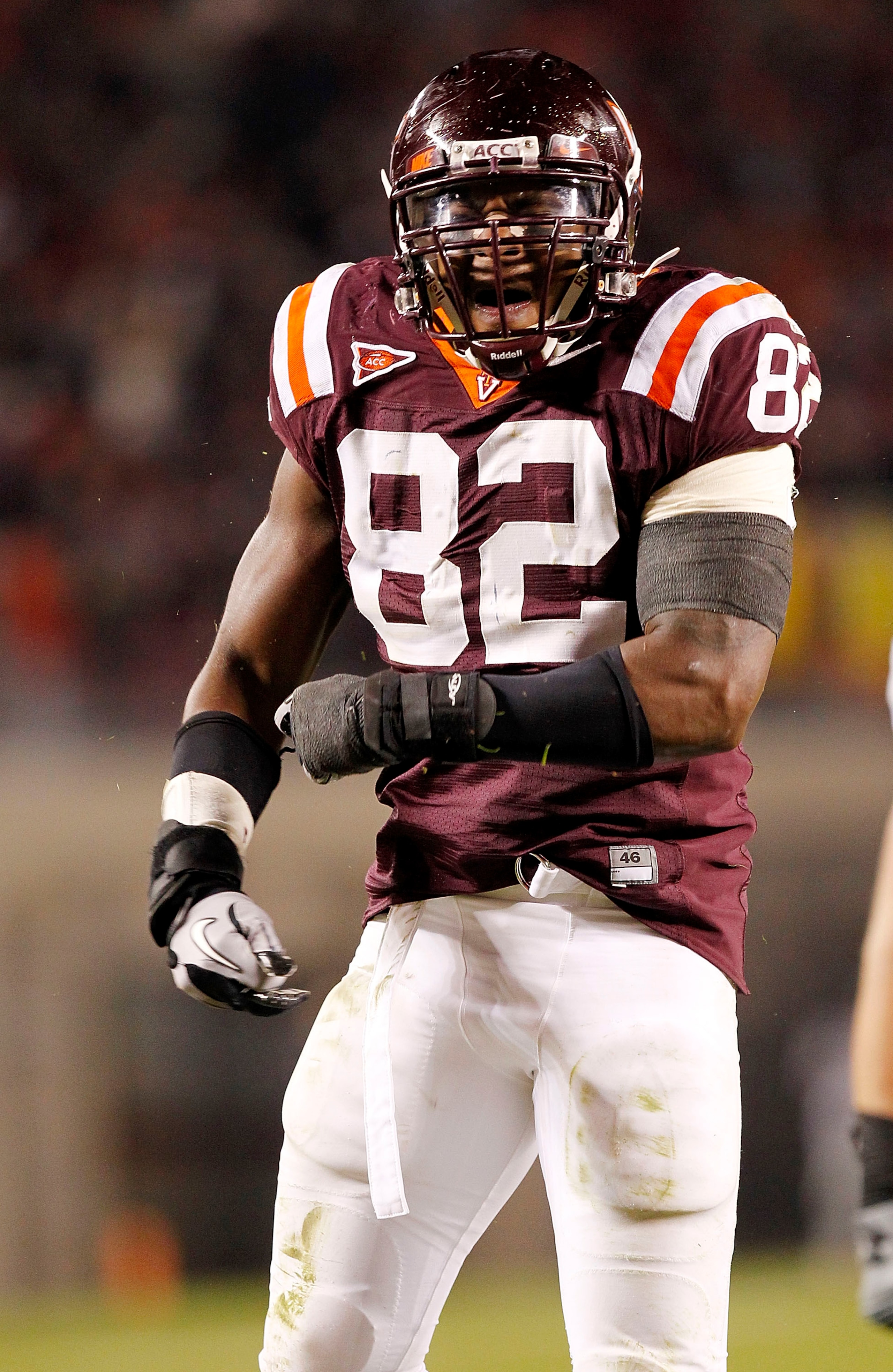 BLACKSBURG, VA - NOVEMBER 04: Defensive end Steven Friday #82 of the Virginia Tech Hokies celebrates after making a tackle against the Georgia Tech Yellow Jackets at Lane Stadium on November 4, 2010 in Blacksburg, Virginia.  (Photo by Geoff Burke/Getty Im