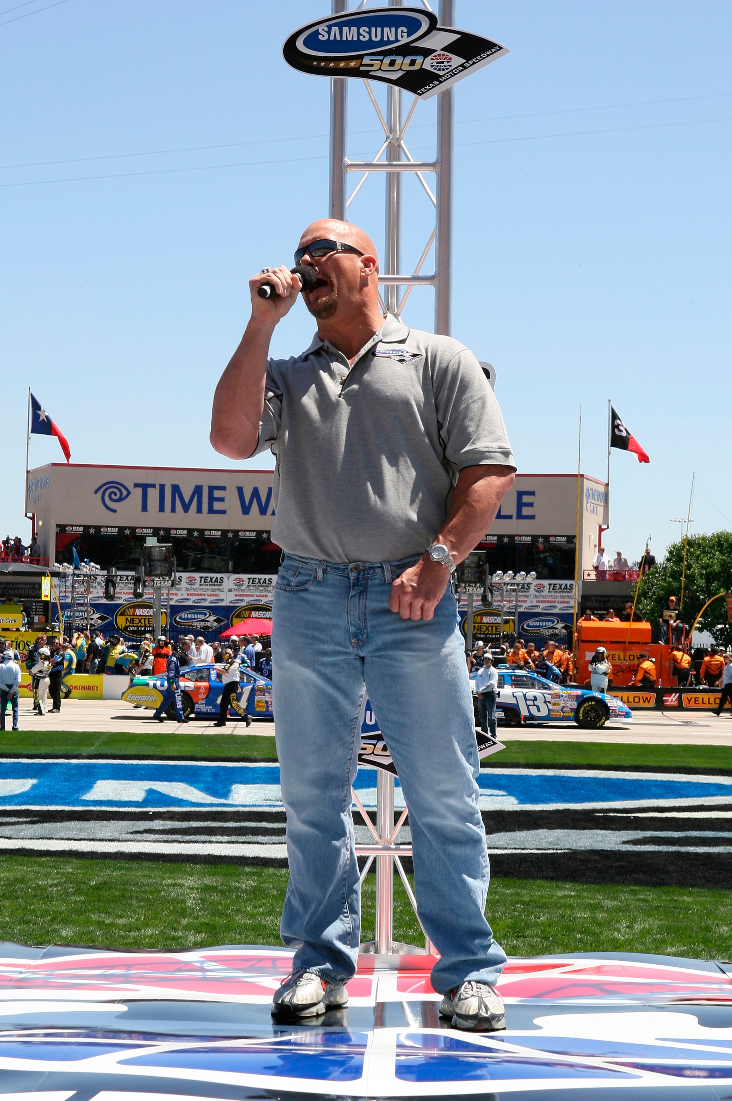 FORT WORTH, TX - APRIL 15: Honorary Starter, WWE wrestler 'Stone Cold' Steve Austin, gives the command for drivers to start their engines prior to the NASCAR Nextel Cup Series Samsung 500 at Texas Motor Speedway on April 15, 2007 in Fort Worth, Texas.  (P