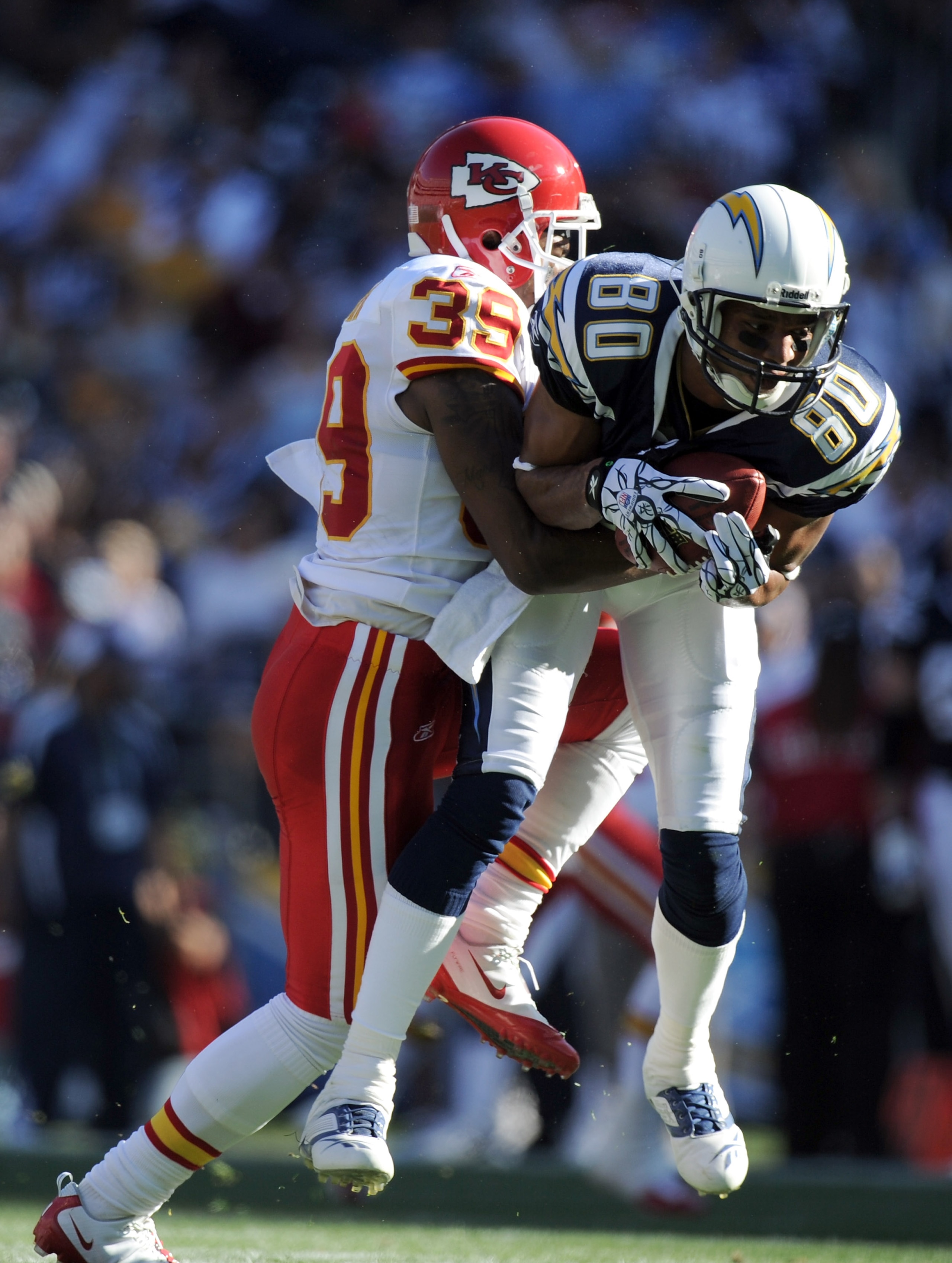 SAN DIEGO, CA - DECEMBER 12:  Malcom Floyd #80 of the San Diego Chargers makes a catch in front of Brandon Carr #39 of the Kansas City Chiefs during the first quarter at Qualcomm Stadium on December 12, 2010 in San Diego, California.  The Chargers won 31-