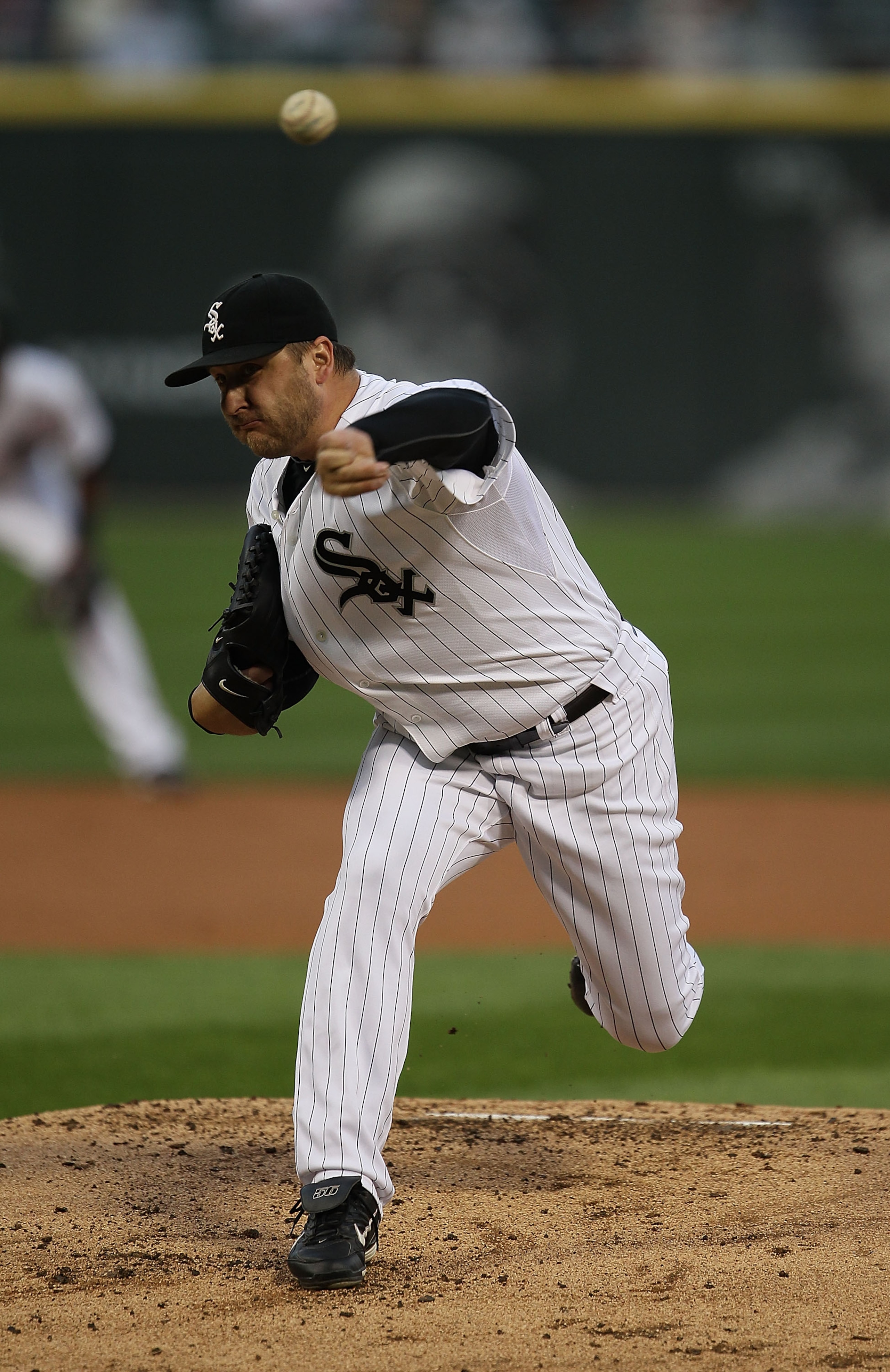 CHICAGO - AUGUST 25: Starting pitcher Mark Buehrle #56 of the Chicago White Sox delivers the ball against the Baltimore Orioles at U.S. Cellular Field on August 25, 2010 in Chicago, Illinois. The Orioles defeated the White Sox 4-2. (Photo by Jonathan Dani