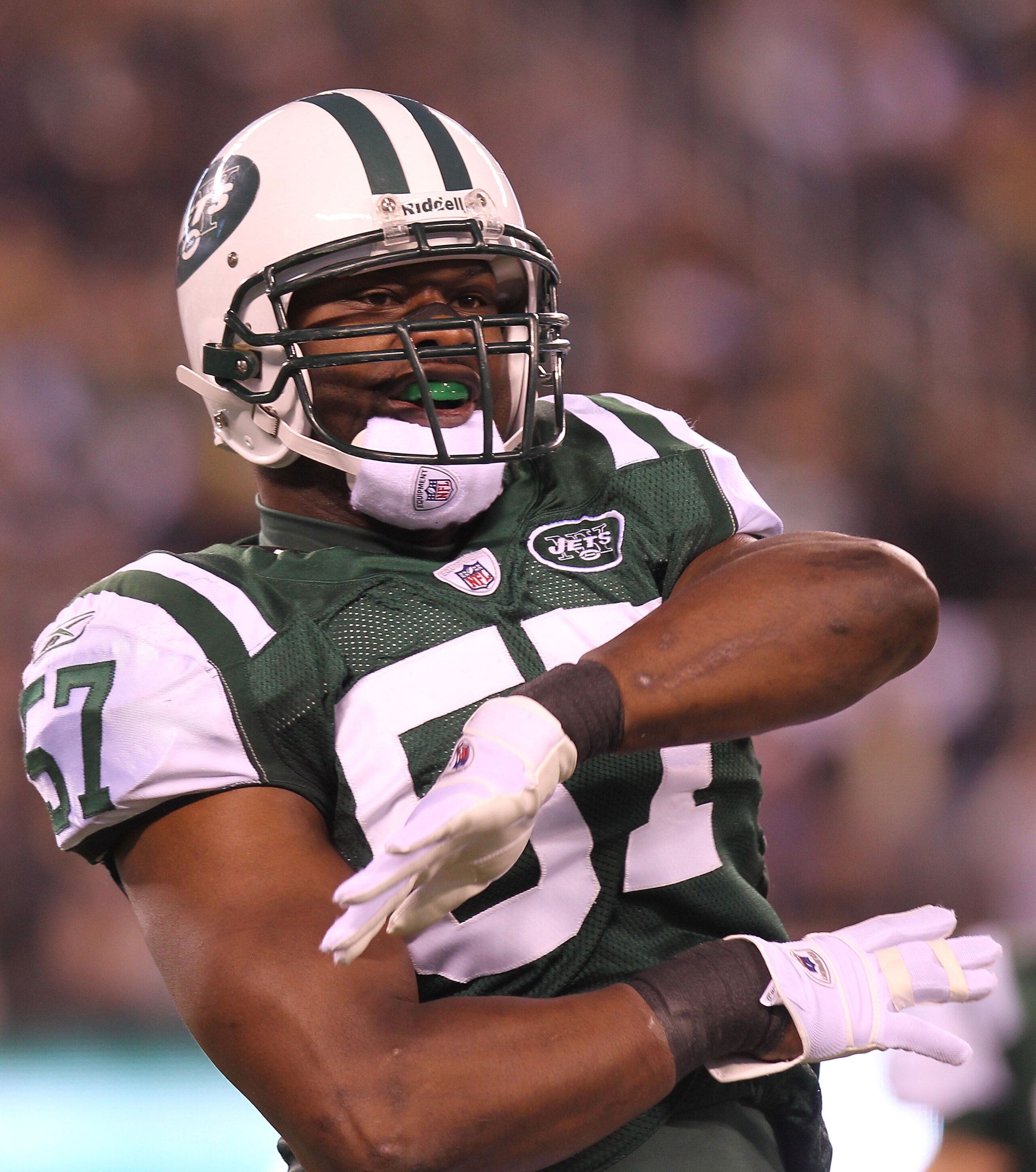 EAST RUTHERFORD, NJ - DECEMBER 12:  Bart Scott #57 of the New York Jets reacts the Miami Dolphins at New Meadowlands Stadium on December 12, 2010 in East Rutherford, New Jersey.  (Photo by Nick Laham/Getty Images)