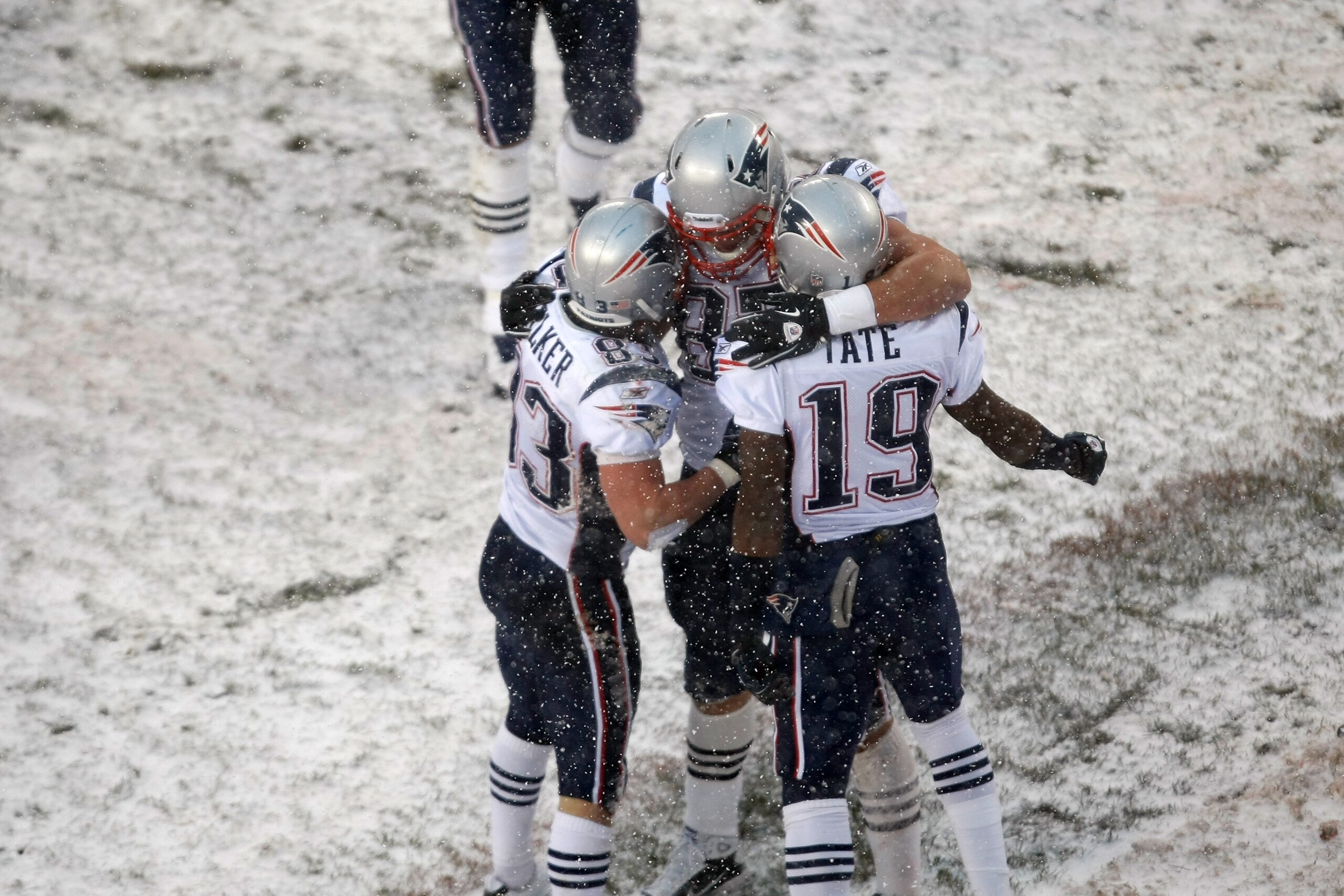 CHICAGO, IL - DECEMBER 12: Rob Gronkowski #87 of the New England Patriots celebrates a touchdown with Golden Tate #19 and Wes Welker #83 against the Chicago Bears at Soldier Field on December 12, 2010 in Chicago, Illinois. The Patriots defeated the Bears