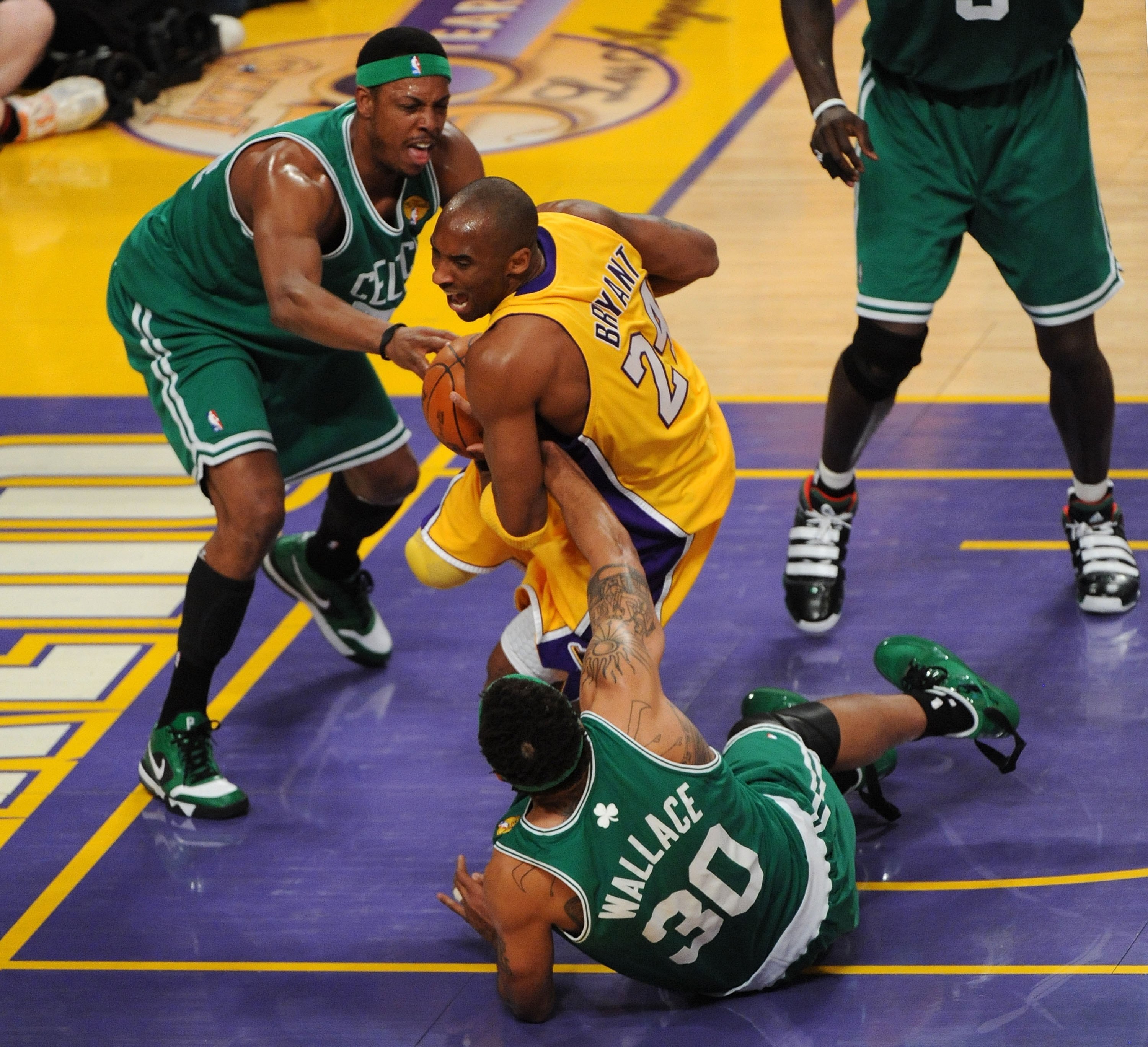 LOS ANGELES, CA - JUNE 17:  Kobe Bryant #24 of the Los Angeles Lakers falls down as Rasheed Wallace #30 of the Boston Celtics goes after the ball in the first quarter of Game Seven of the 2010 NBA Finals at Staples Center on June 17, 2010 in Los Angeles,