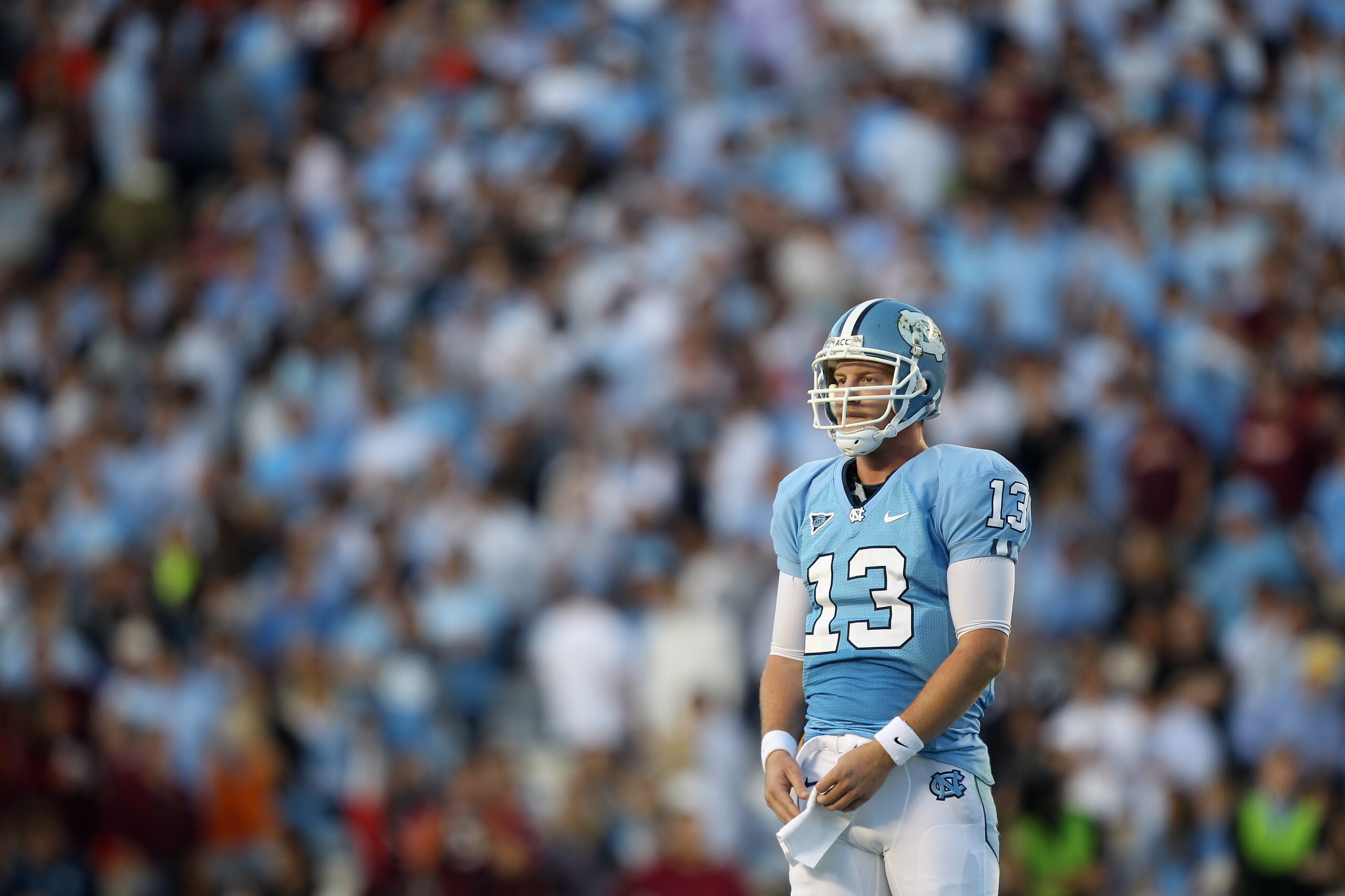 CHAPEL HILL, NC - NOVEMBER 13: T.J. Yates #13 of the North Carolina Tar Heels waits for a play from the sidelines against the Virginia Tech Hokies during their game at Kenan Stadium on November 13, 2010 in Chapel Hill, North Carolina. (Photo by Streeter CHAPEL HILL, NC - NOVEMBER 13: T.J. Yates #13 of the North Carolina Tar Heels waits for a play from the sidelines against the Virginia Tech Hokies during their game at Kenan Stadium on November 13, 2010 in Chapel Hill, North Carolina. (Photo by Streeter