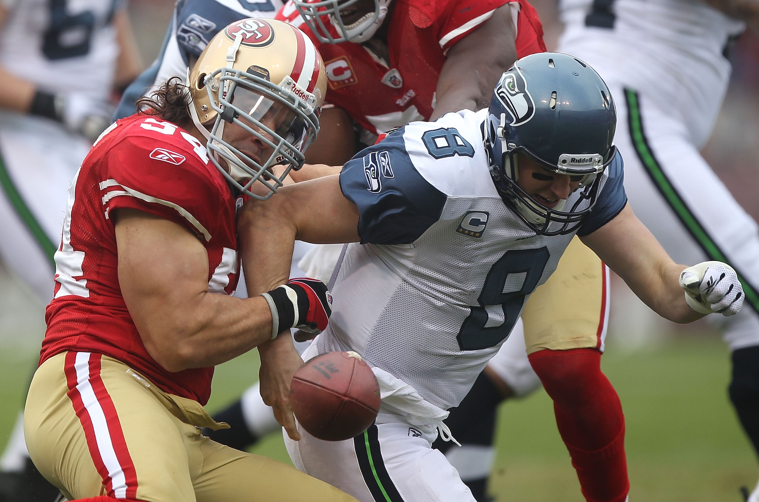 SAN FRANCISCO - DECEMBER 12:    Travis LaBoy #54 of the San Francisco 49ers sacks Matt Hasselbeck #8 of the Seattle Seahawks during an NFL game at Candlestick Park on December 12, 2010 in San Francisco, California.  (Photo by Jed Jacobsohn/Getty Images)