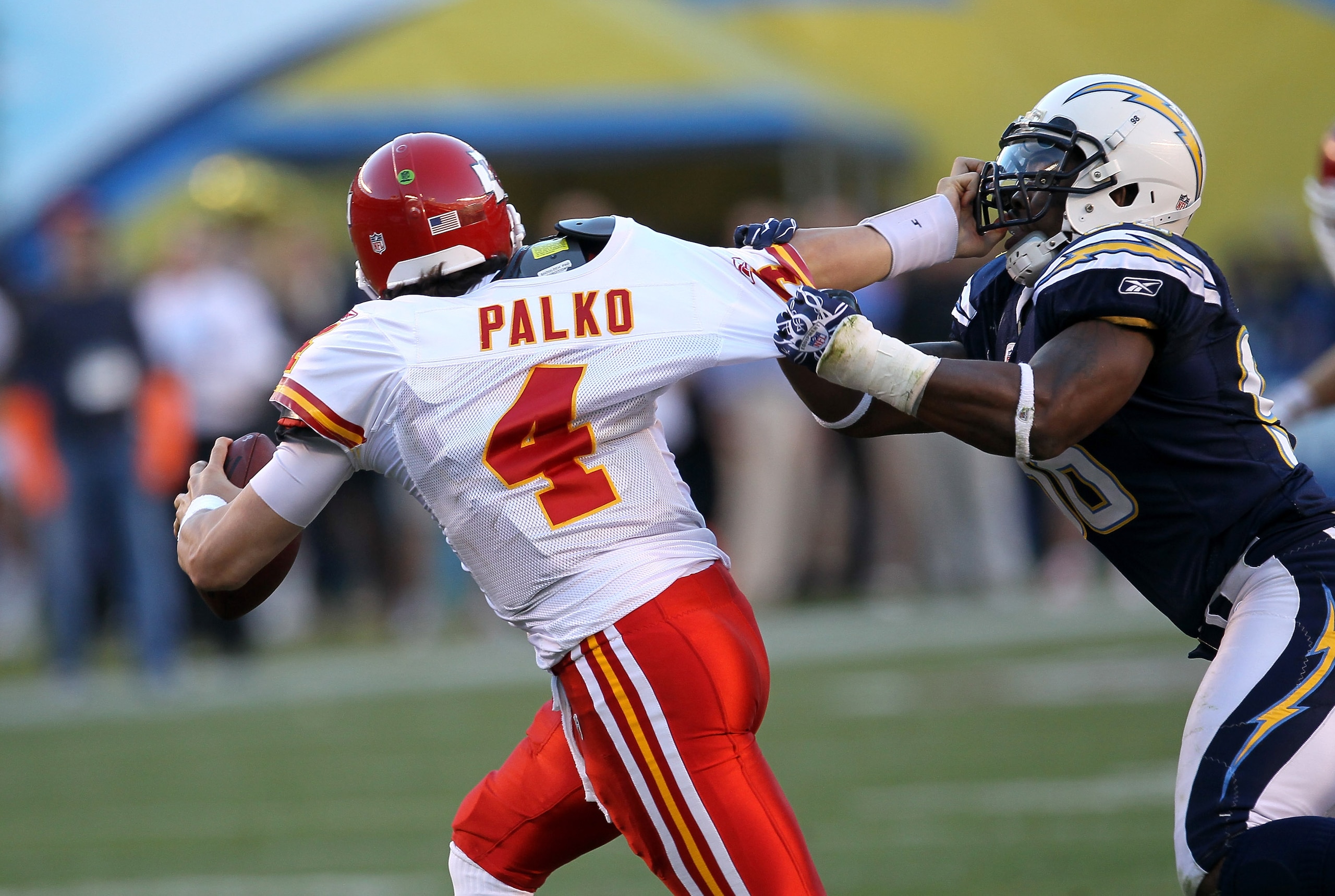 SAN DIEGO - DECEMBER 12:  Quarterback Tyler Palko #4 of the Kansas City Chiefs tries to fend off linebacker Antwan Barnes #98 of the San Diego Chargers at Qualcomm Stadium on December 12, 2010 in San Diego, California.  The Chargers won 31-0.  (Photo by S