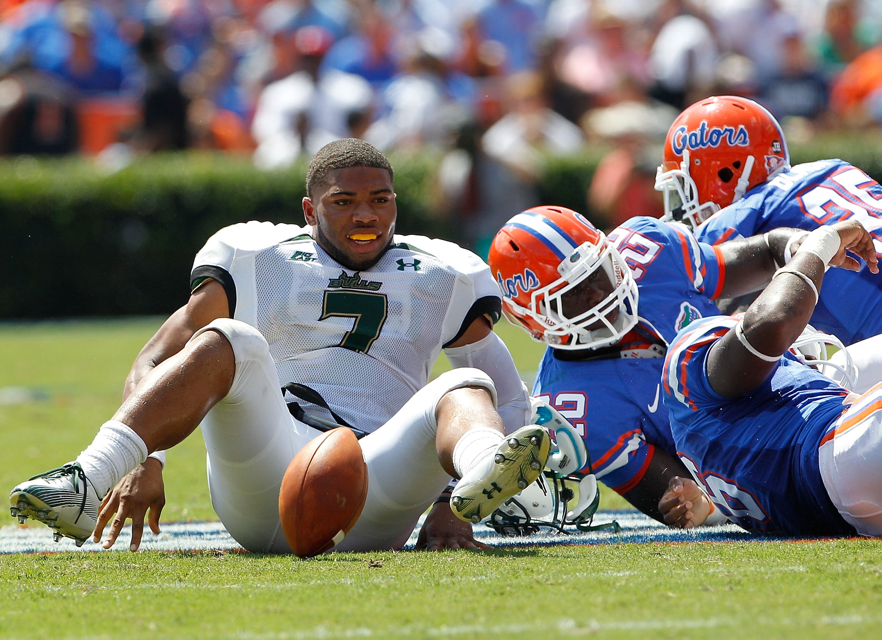 GAINESVILLE, FL - SEPTEMBER 11:  Quarterback B.J. Daniels #7 of the South Florida Bulls loses his helmet after being tackled during a game against the Florida Gators at Ben Hill Griffin Stadium on September 11, 2010 in Gainesville, Florida.  (Photo by Sam