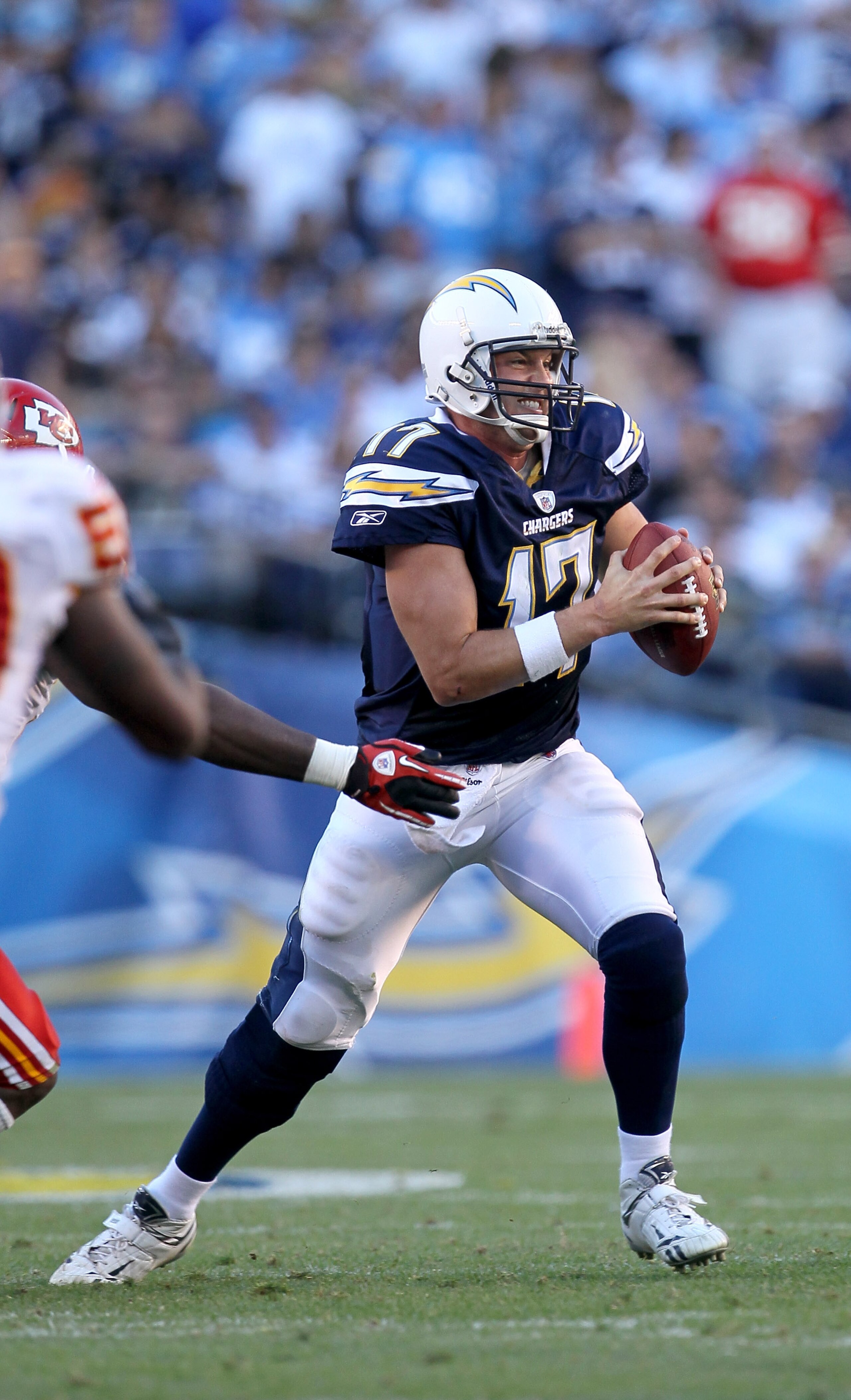 SAN DIEGO - DECEMBER 12:  Quarterbaqck Philip Rivers #17 of the San Diego Chargers eludes a tackle in the game against the Kansas City Chiefs at Qualcomm Stadium on December 12, 2010 in San Diego, California.  the Chargers won 31-0.  (Photo by Stephen Dun