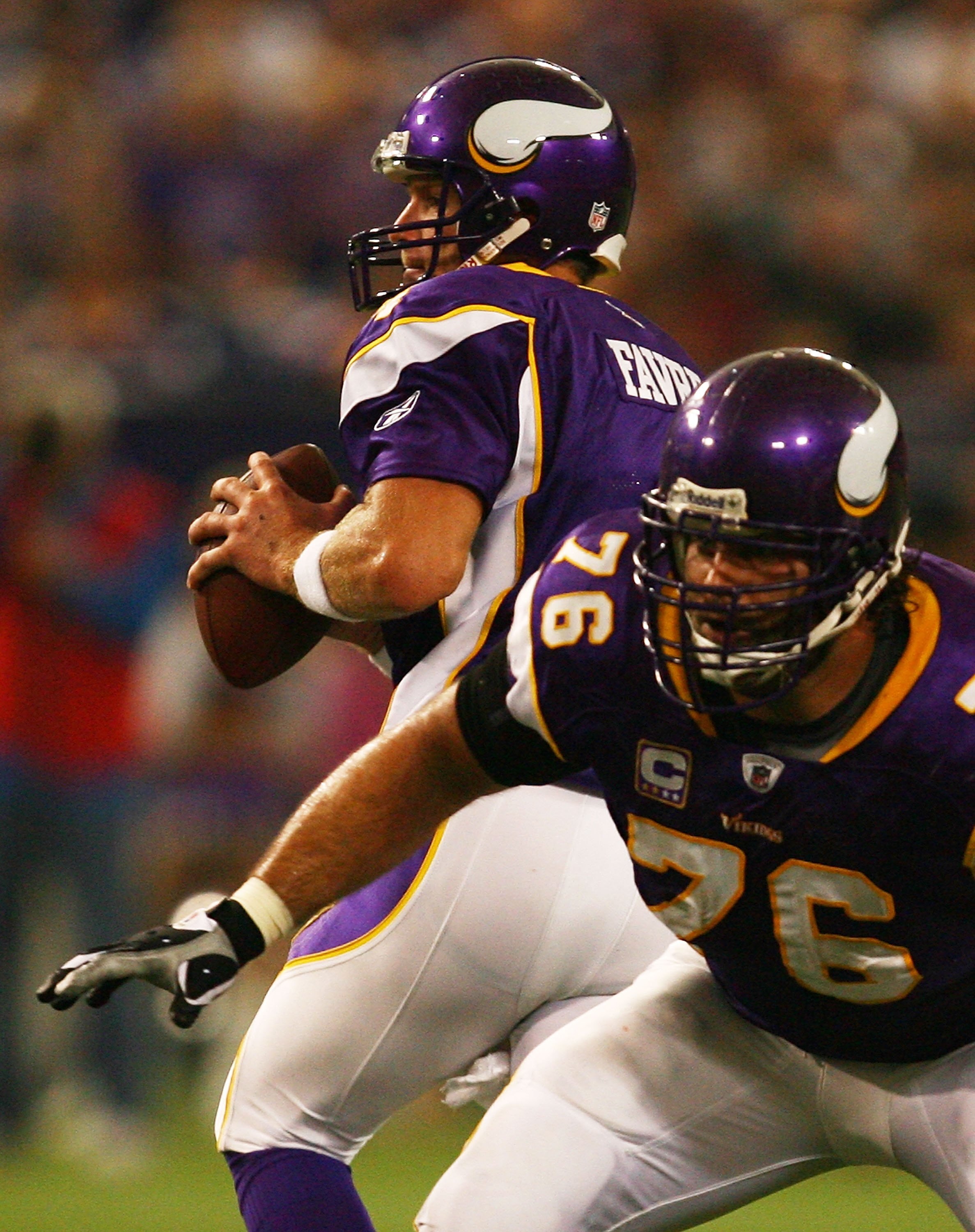 MINNEAPOLIS - SEPTEMBER 27: Brett Favre #4 of the Minnesota Vikings drops back to pass as teammate Steve Hutchinson #76 prepares to block against the San Francisco 49ers at the Hubert H. Humphrey Metrodome on September 27, 2009 in Minneapolis, Minnesota.