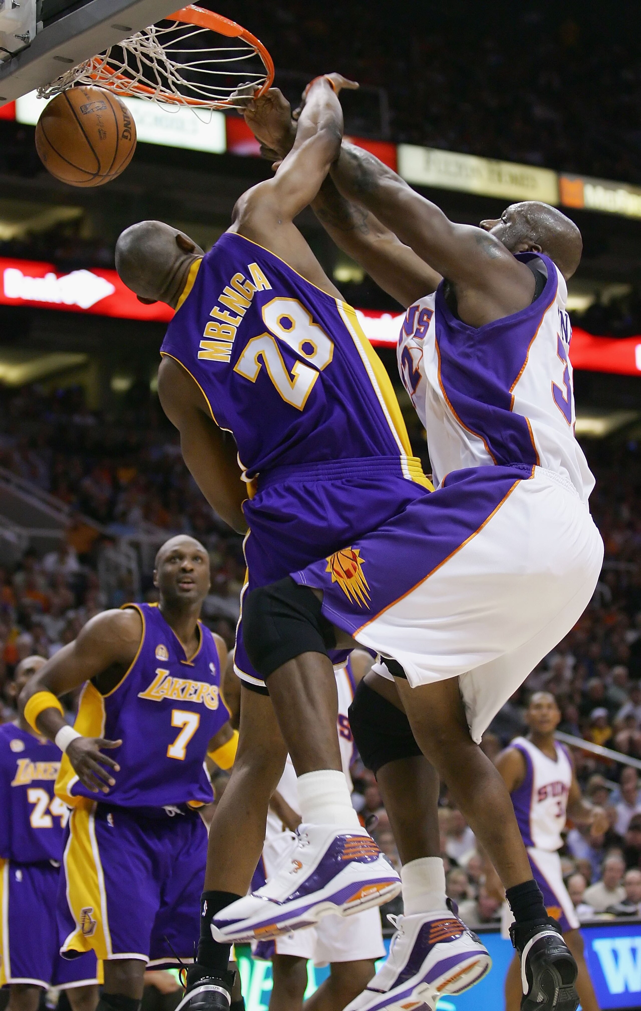 PHOENIX - FEBRUARY 20:   Shaquille O'Neal #32 of the Phoenix Suns slam dunks against DJ Mbenga #28 of the Los Angeles Lakers at US Airways Center on February 20, 2008 in Phoenix, Arizona.  NOTE TO USER: User expressly acknowledges and agrees that, by down