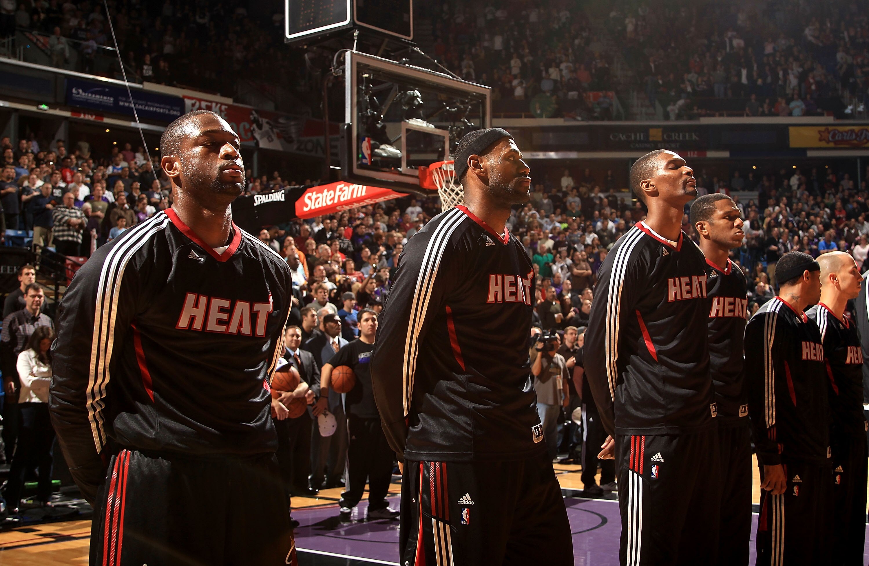 SACRAMENTO, CA - DECEMBER 11:  Dwayne Wade #3, Lebron James #6 and Chris Bosh #1 of the Miami Heat stand for the National Anthem before their game against the Sacramento Kings at ARCO Arena on December 11, 2010 in Sacramento, California.  NOTE TO USER: Us
