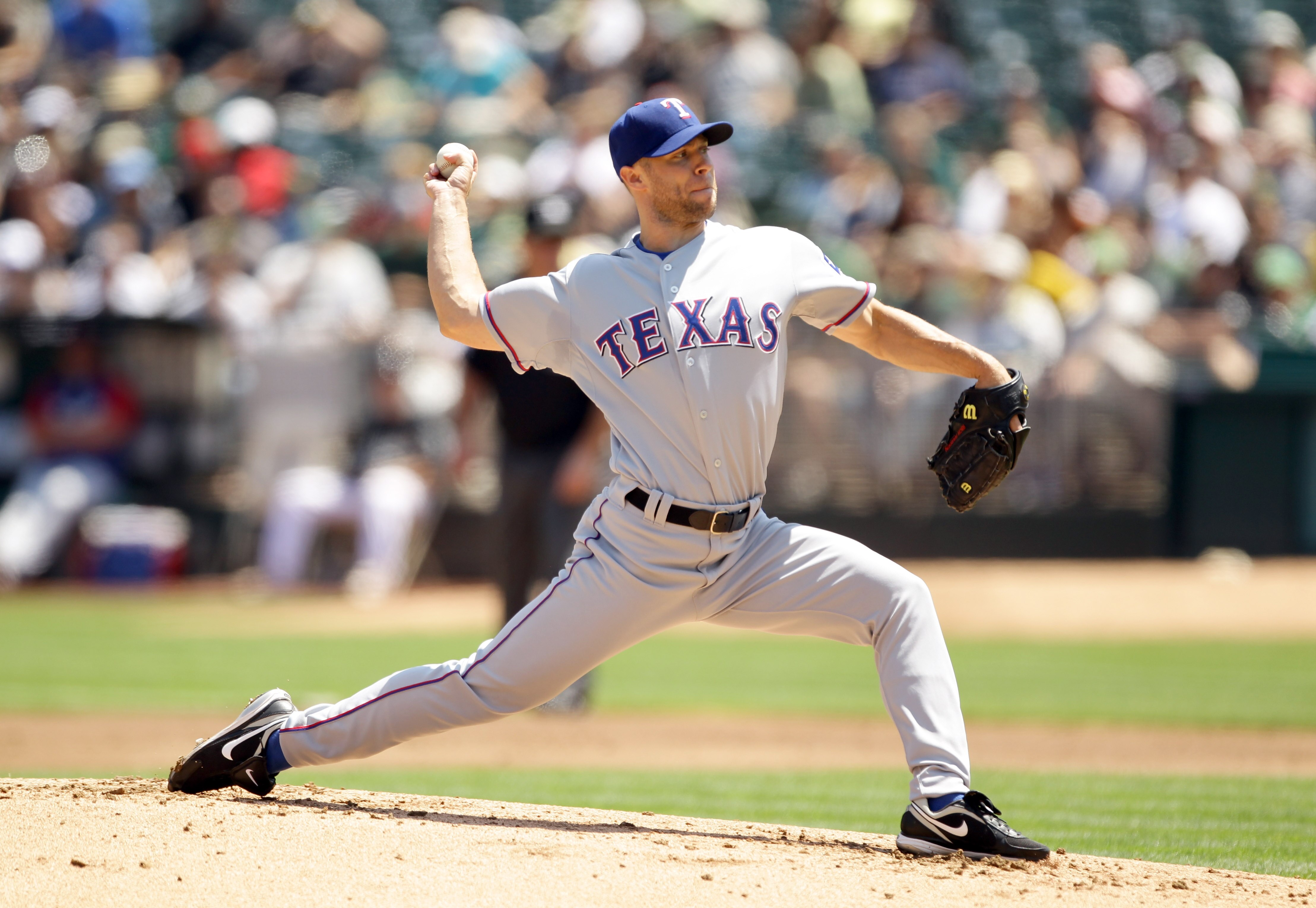 OAKLAND, CA - AUGUST 07:  Rich Harden #40 of the Texas Rangers pitches against the Oakland Athletics at the Oakland-Alameda County Coliseum on August 7, 2010 in Oakland, California.  (Photo by Ezra Shaw/Getty Images)