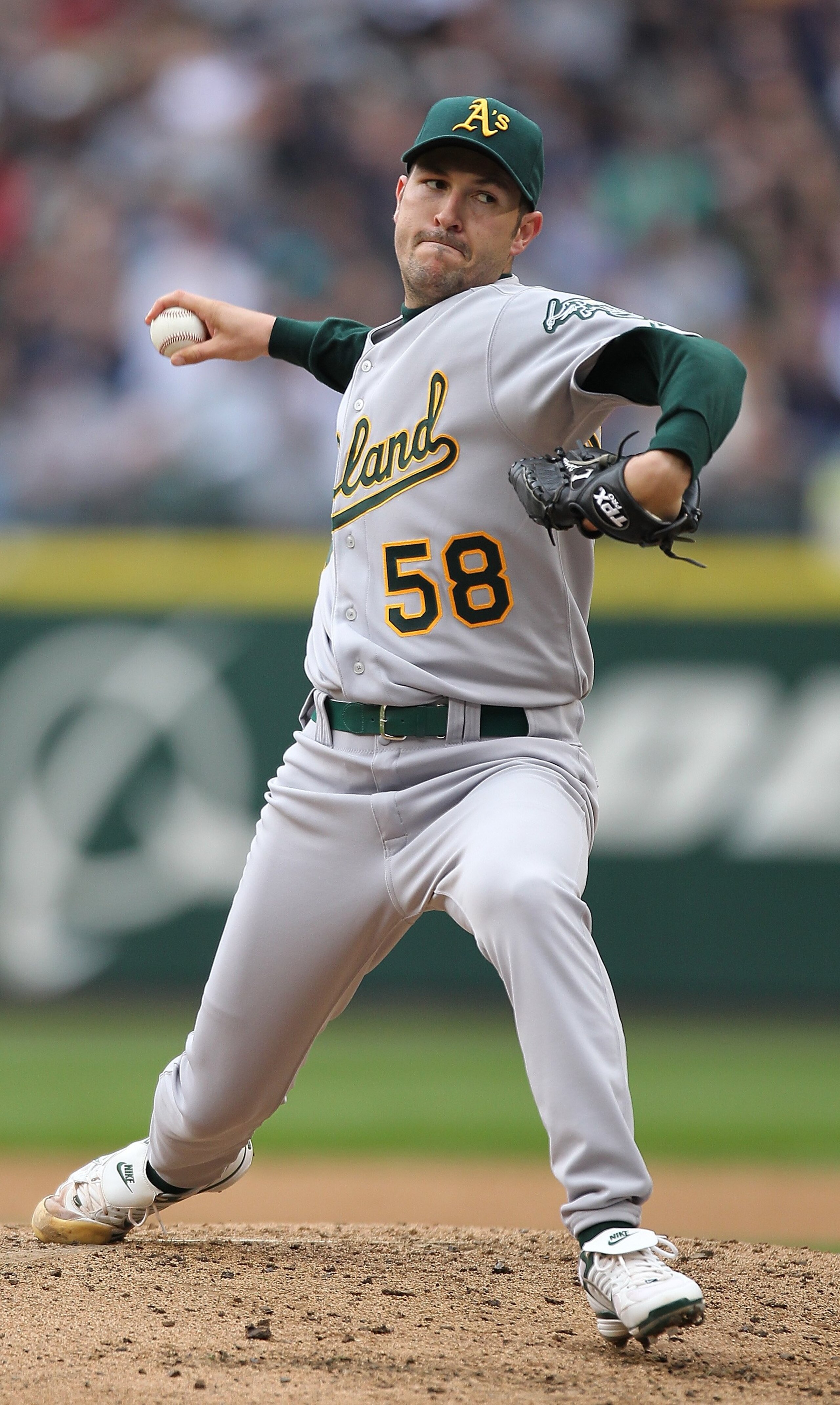 SEATTLE - APRIL 12:  Starting pitcher Justin Duchscherer #58 of the the Oakland Athletics pitches against the Seattle Mariners during the Mariners' home opener at Safeco Field on April 12, 2010 in Seattle, Washington. (Photo by Otto Greule Jr/Getty Images