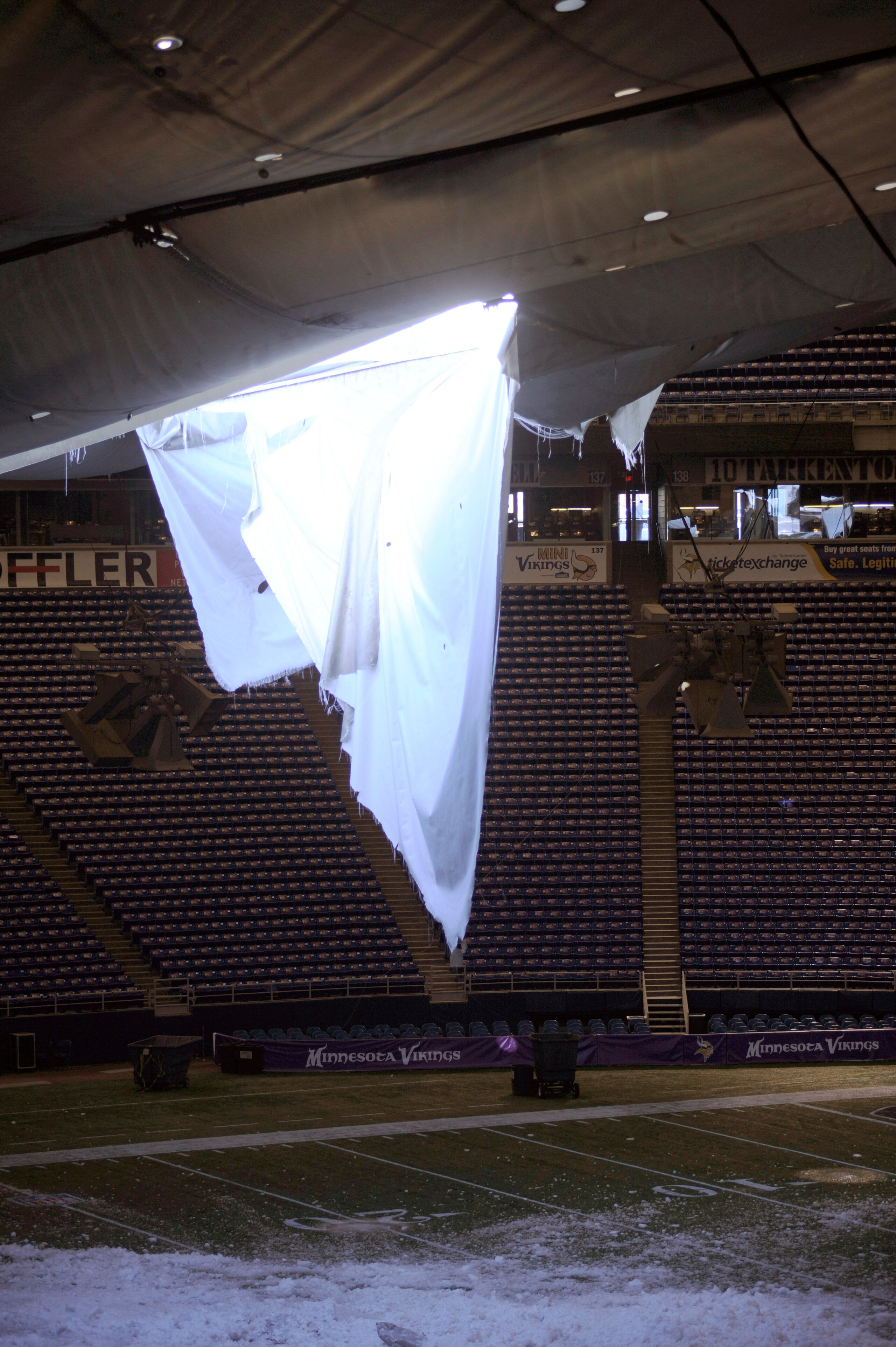 MINNEAPOLIS, MN - DECEMBER 13: A torn section of the roof sags inside the Hubert H. Humphrey Metrodome on December 13, 2010 in Minneapolis, Minnesota. The Metrodome's roof collapsed under the weight of snow after a powerful blizzard hit the area on Decemb