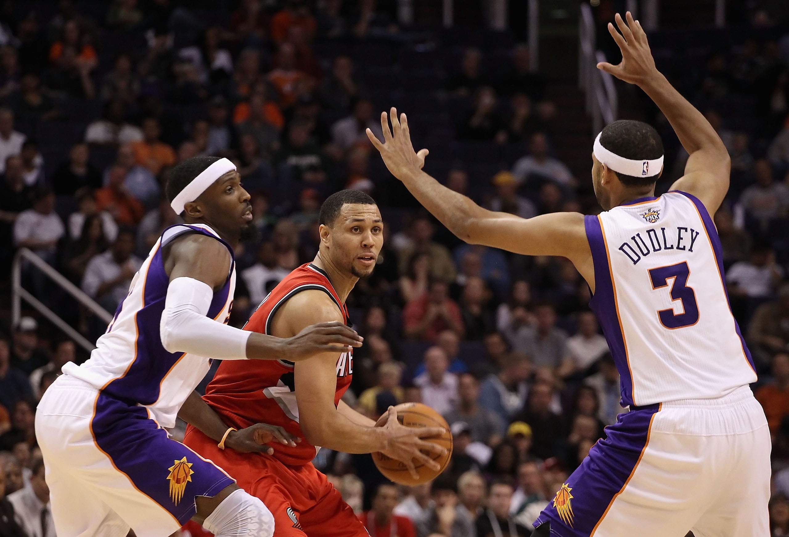 PHOENIX - DECEMBER 10:  Brandon Roy #7 of the Portland Trail Blazers looks to pass the ball during the NBA game against the Phoenix Suns at US Airways Center on December 10, 2010 in Phoenix, Arizona. The Trail Blazers defeated the Suns 101-94. NOTE TO USE