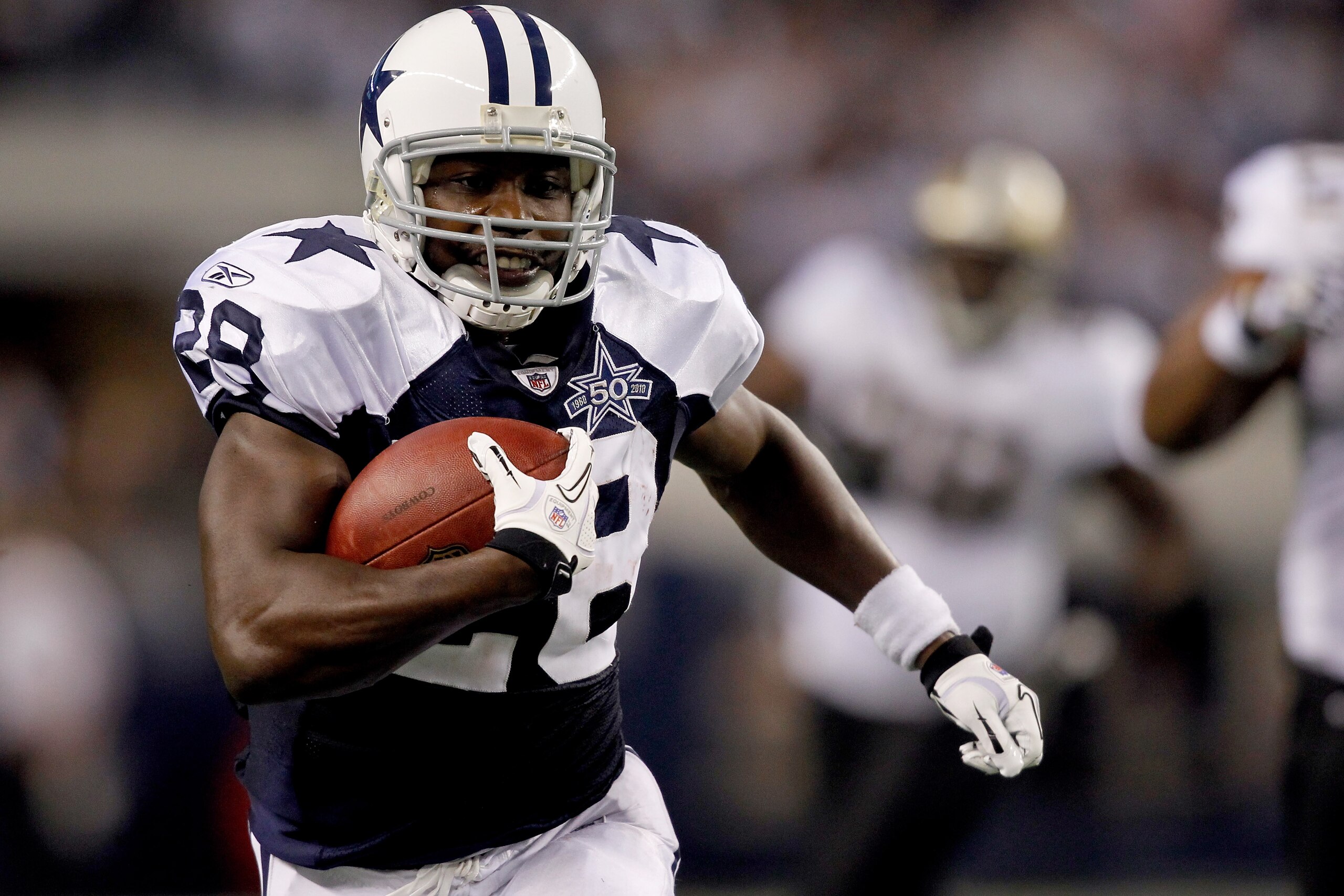ARLINGTON, TX - NOVEMBER 25:  Felix Jones #28 of the Dallas Cowboys at Cowboys carries the ball after making a reception against the New Orleans Saints at Cowboys Stadium on November 25, 2010 in Arlington, Texas.  (Photo by Matthew Stockman/Getty Images)
