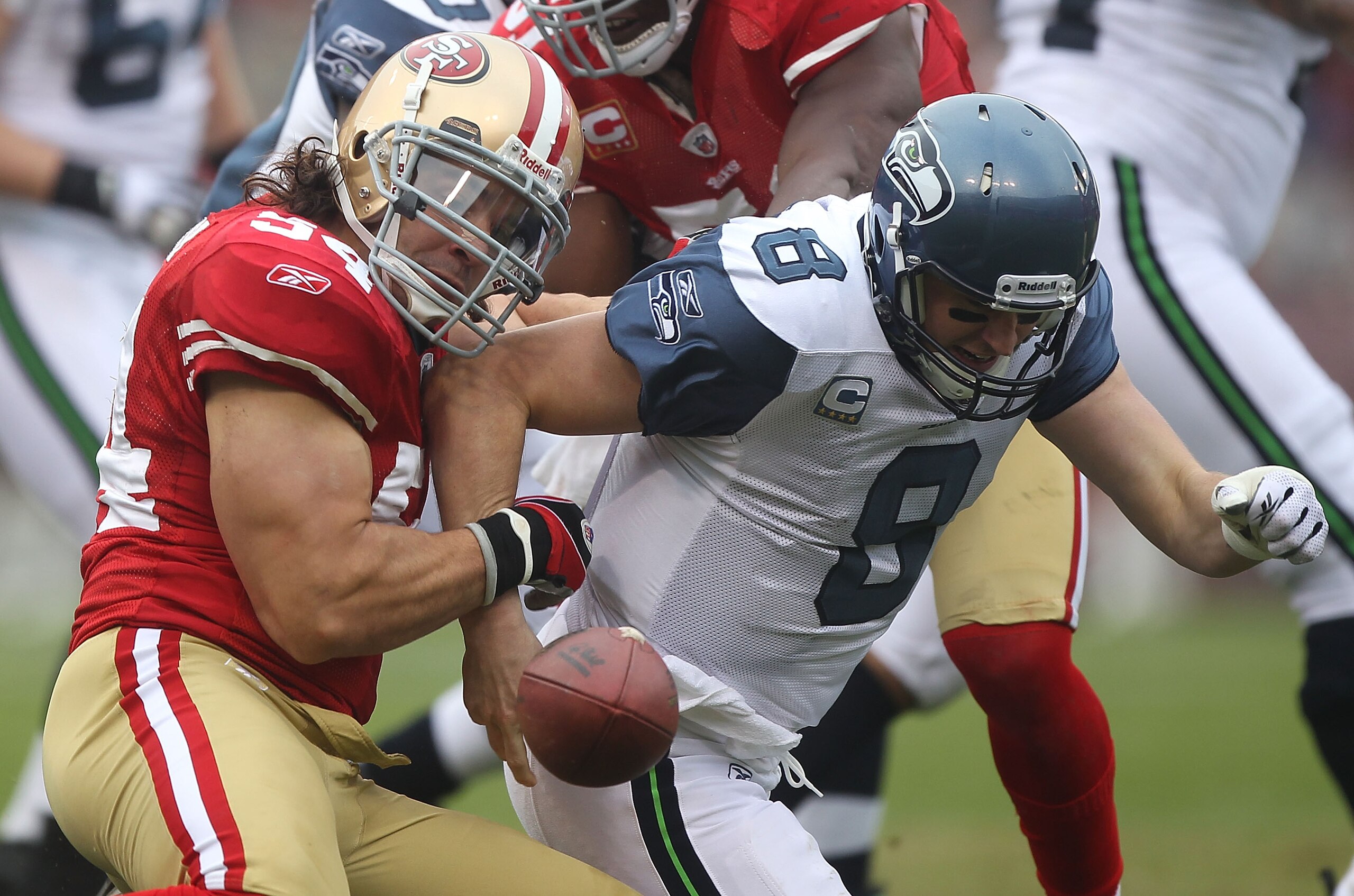 SAN FRANCISCO - DECEMBER 12:    Travis LaBoy #54 of the San Francisco 49ers sacks Matt Hasselbeck #8 of the Seattle Seahawks during an NFL game at Candlestick Park on December 12, 2010 in San Francisco, California.  (Photo by Jed Jacobsohn/Getty Images)