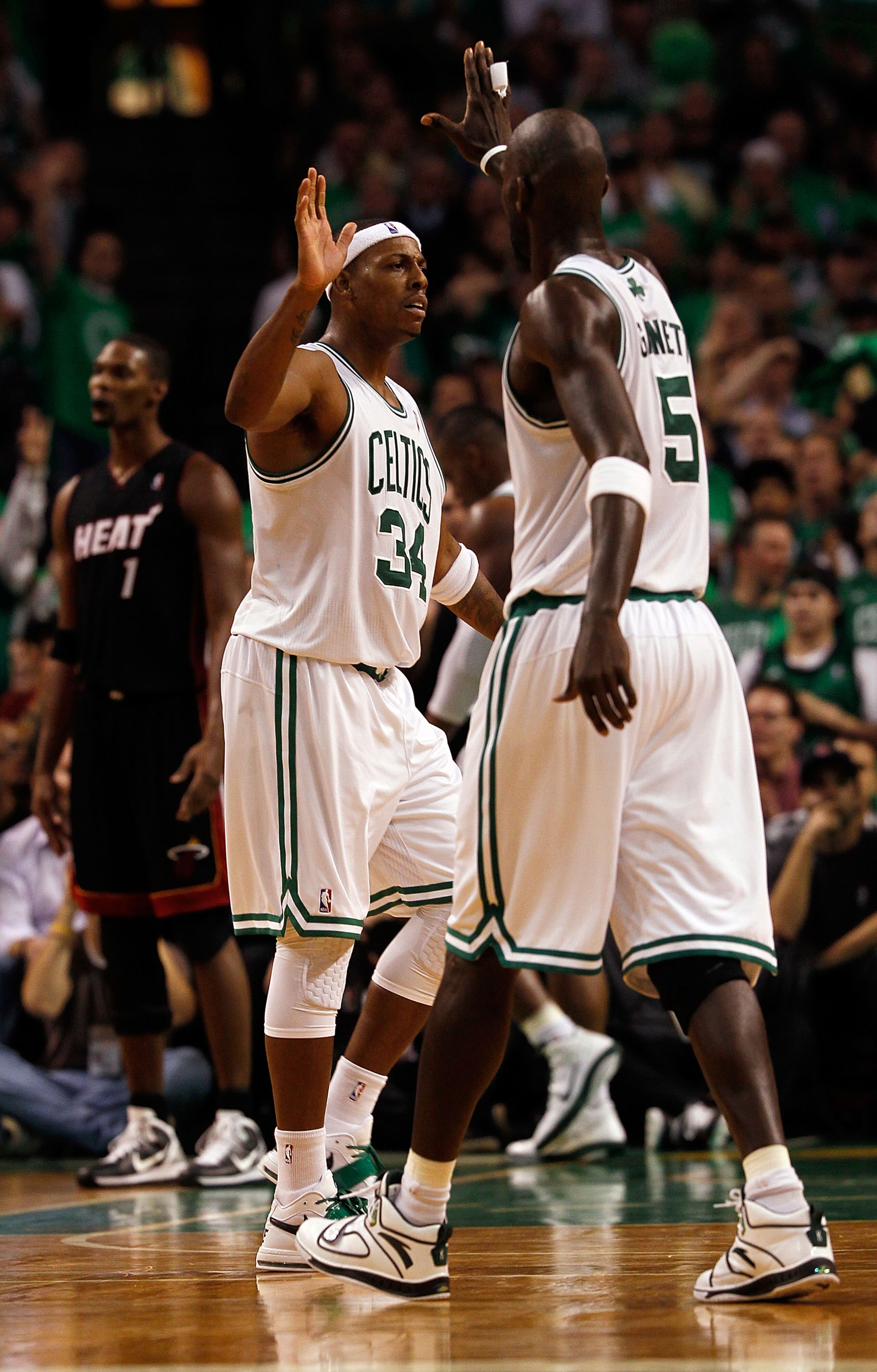 BOSTON, MA - OCTOBER 26:  Paul Pierce #34 of the Boston Celtics celebrates with teammate Kevin Garnett #5 during a game against the Miami Heat at the TD Banknorth Garden on October 26, 2010 in Boston, Massachusetts. NOTE TO USER: User expressly acknowledg