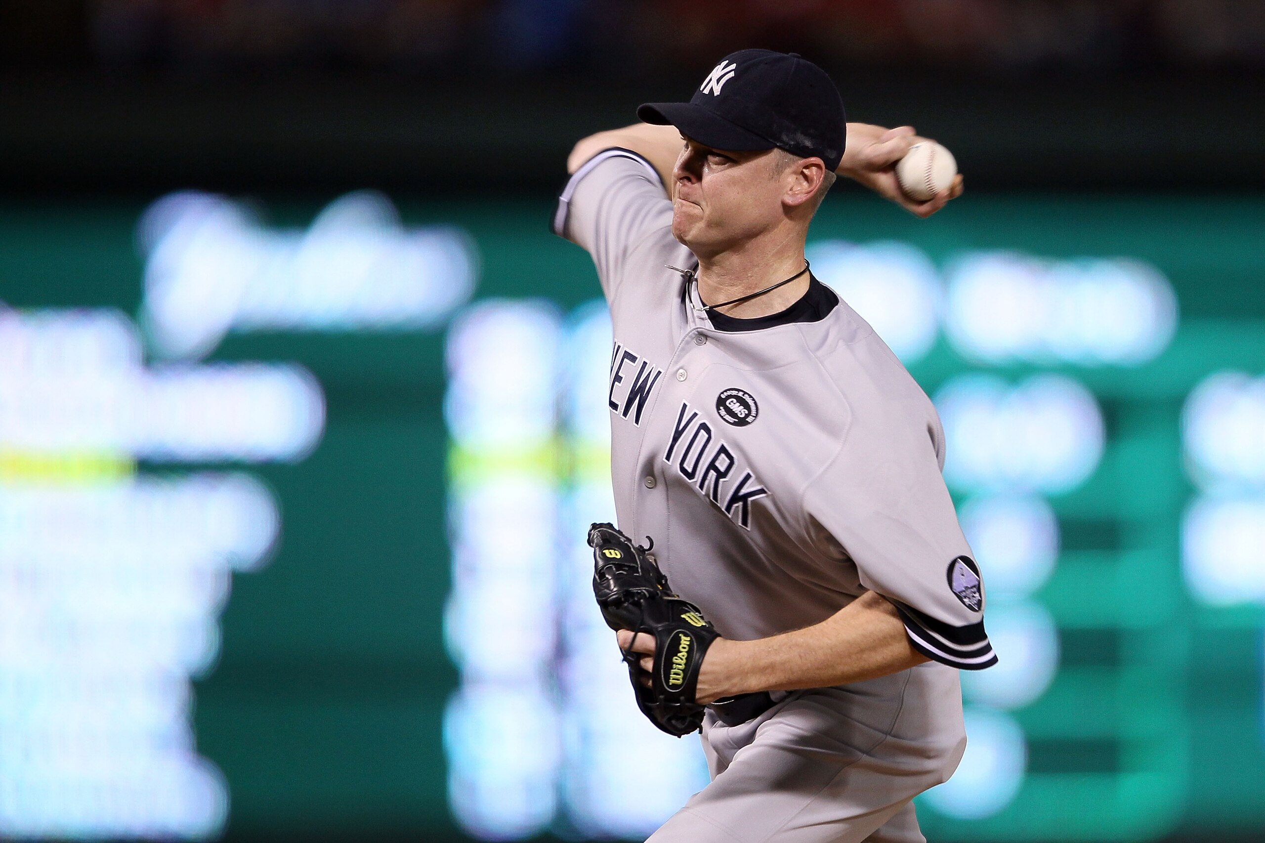 ARLINGTON, TX - OCTOBER 22:  Kerry Wood #39 of the New York Yankees throws a pitch against the Texas Rangers in Game Six of the ALCS during the 2010 MLB Playoffs at Rangers Ballpark in Arlington on October 22, 2010 in Arlington, Texas. The Rangers won 6-1